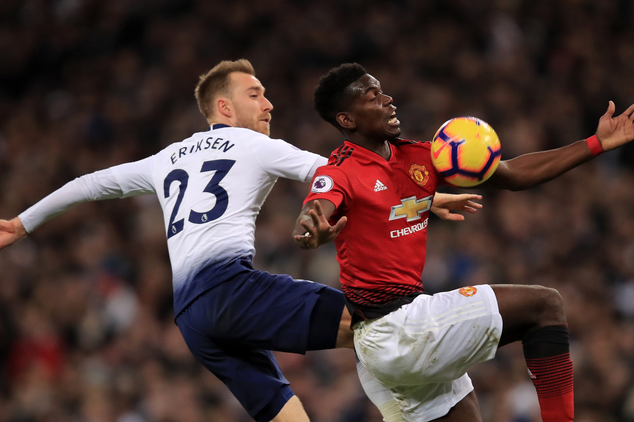 LONDON, ENGLAND - JANUARY 13: Christian Eriksen of Tottenham Hotspur in action with Paul Pogba of Manchester United during the Premier League match between Tottenham Hotspur and Manchester United at Wembley Stadium on January 13, 2019 in London, United Ki