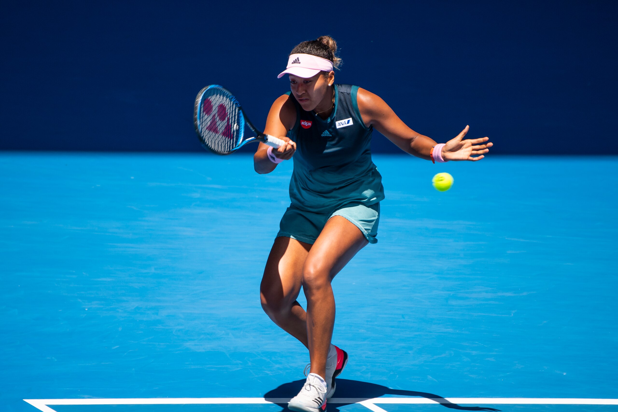 MELBOURNE, AUSTRALIA - JANUARY 23: Naomi Osaka of Japan hits a forehand to Elina Svitolina of Ukraine during day 10 of the 2019 Australian Open at Melbourne Park on January 23, 2019 in Melbourne, Australia. (Photo by TPN/Getty Images)