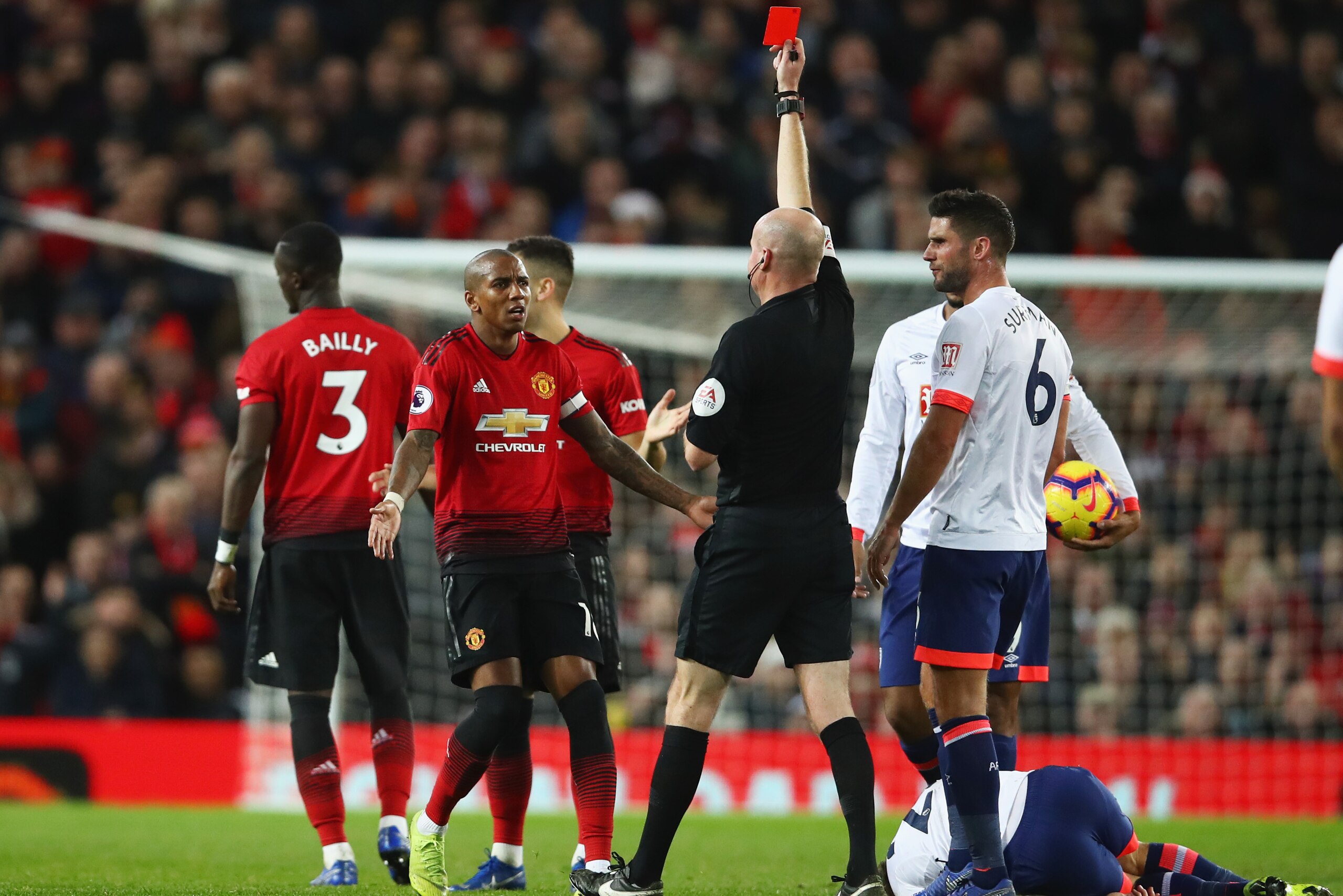 MANCHESTER, ENGLAND - DECEMBER 30:  Ashley Young of Manchester United appeals as Eric Bailly of Manchester United (3) is shown a red card and is sent off by referee Lee Mason during the Premier League match between Manchester United and AFC Bournemouth at