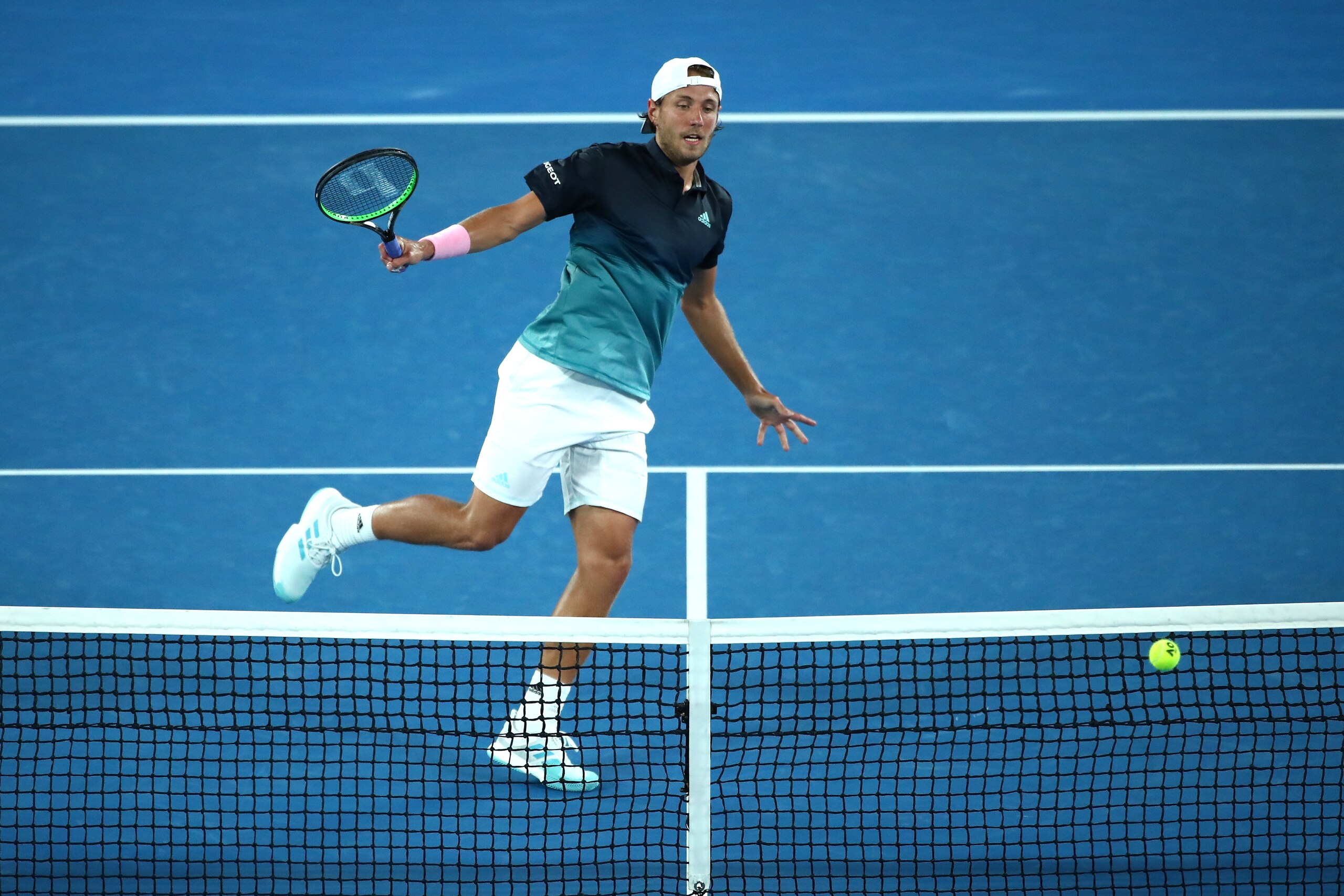 MELBOURNE, AUSTRALIA - JANUARY 25:  Lucas Pouille of France plays a backhand in his men's semi final match against Novak Djokovic of Serbia during day 12 of the 2019 Australian Open at Melbourne Park on January 25, 2019 in Melbourne, Australia.  (Photo by