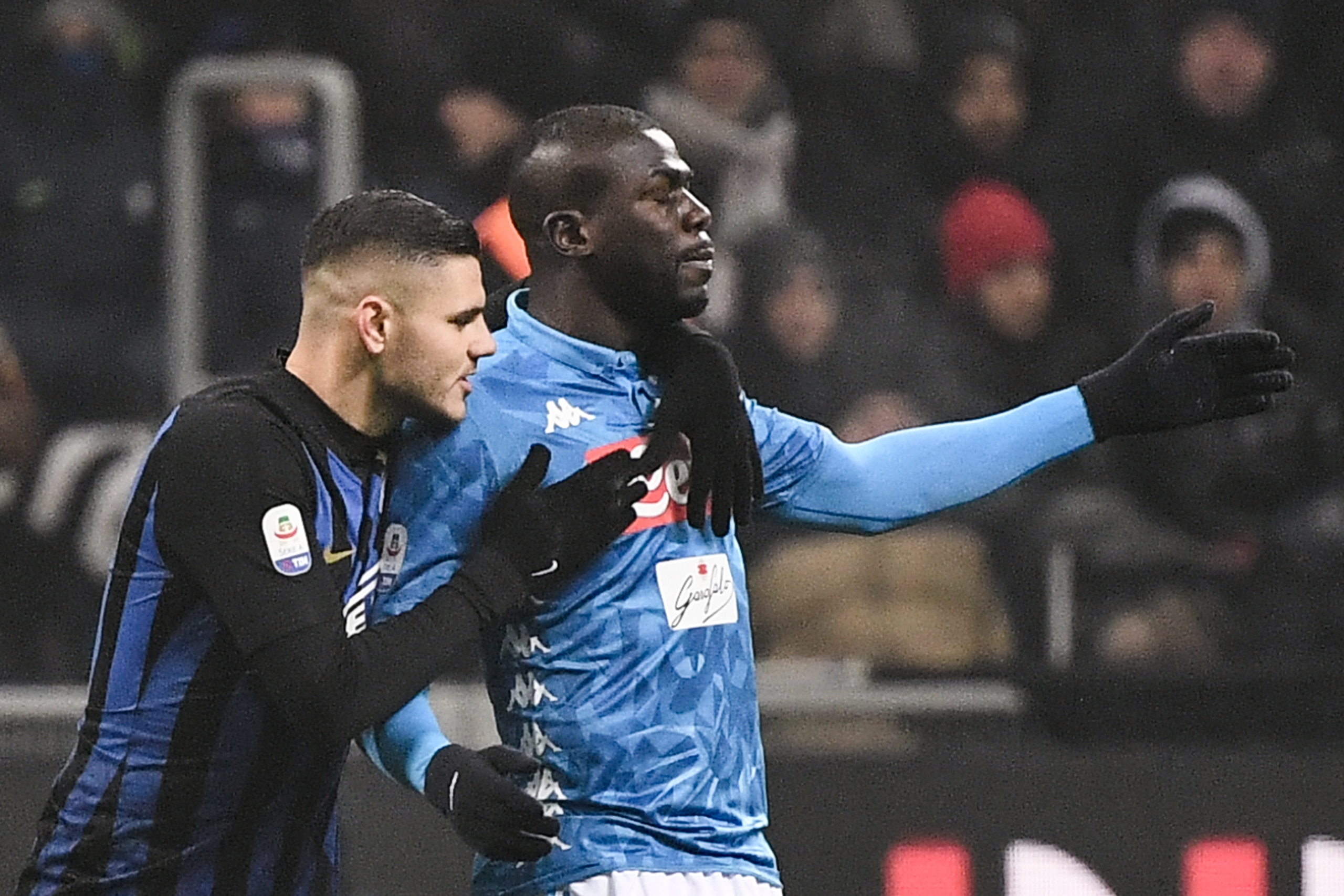 Inter Milan's Argentine forward Mauro Icardi (L) comforts Napoli's Senegalese defender Kalidou Koulibaly after he received a red card during the Italian Serie A football match Inter Milan vs Napoli on December 26, 2018 at the San Siro stadium in Milan. (P