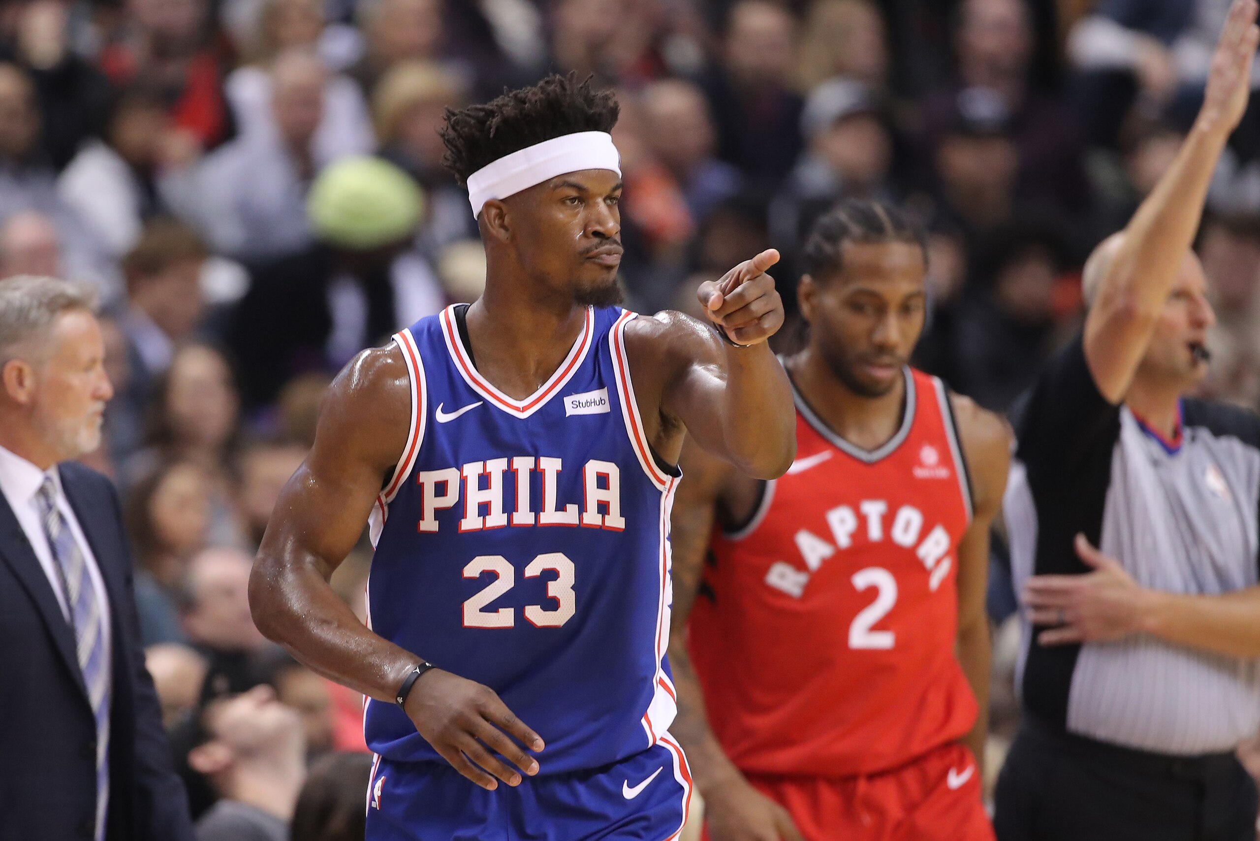 TORONTO, ON - DECEMBER 05: Jimmy Butler #23 of the Philadelphia 76ers reacts after scoring a three-pointer in the second quarter as Kawhi Leonard #2 of the Toronto Raptors looks on at Scotiabank Arena on December 5, 2018 in Toronto, Canada. NOTE TO USER: 