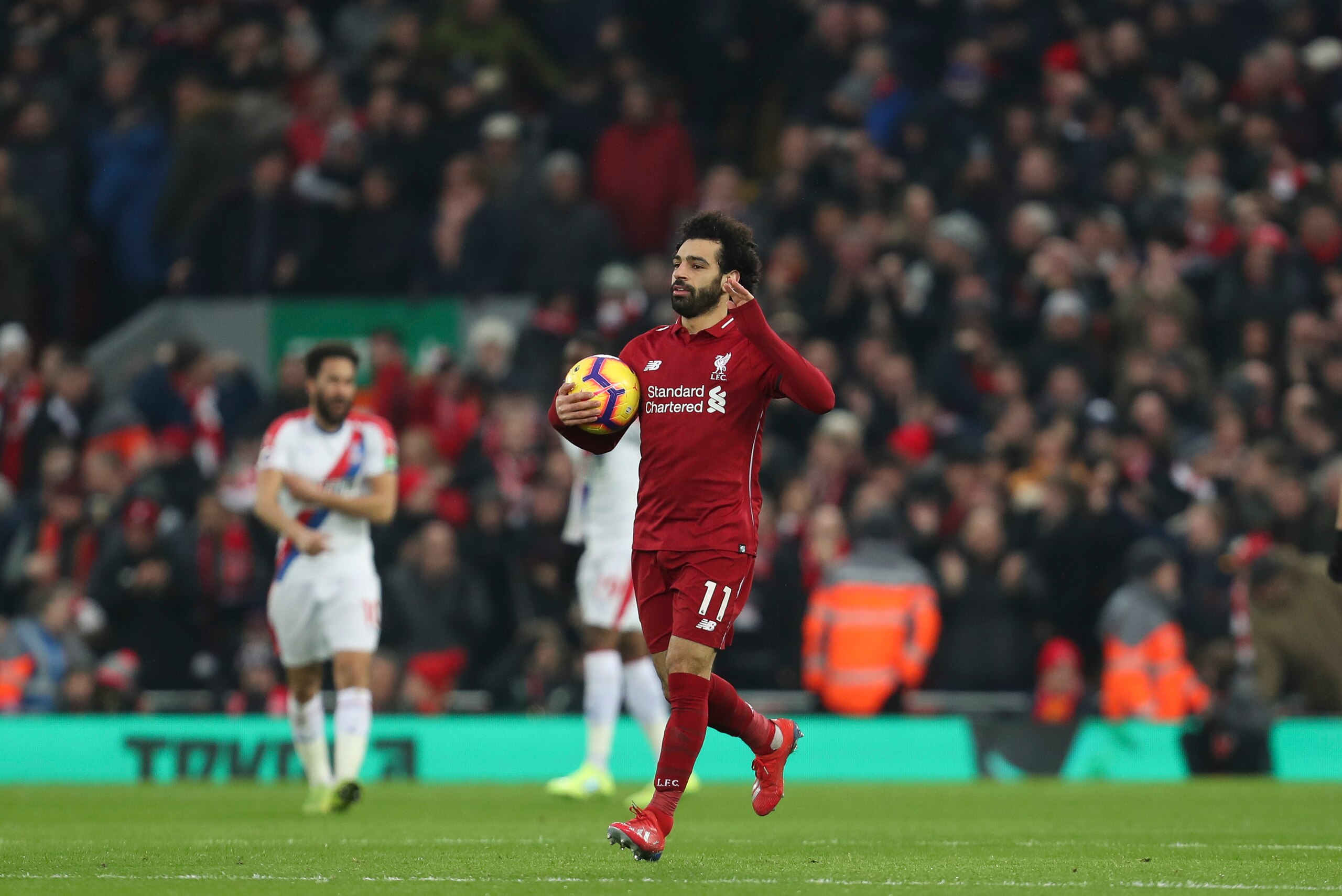 LIVERPOOL, ENGLAND - JANUARY 19: Mohamed Salah of Liverpool celebrates after scoring a goal to make it 1-1 during the Premier League match between Liverpool FC and Crystal Palace at Anfield on January 19, 2019 in Liverpool, United Kingdom. (Photo by James
