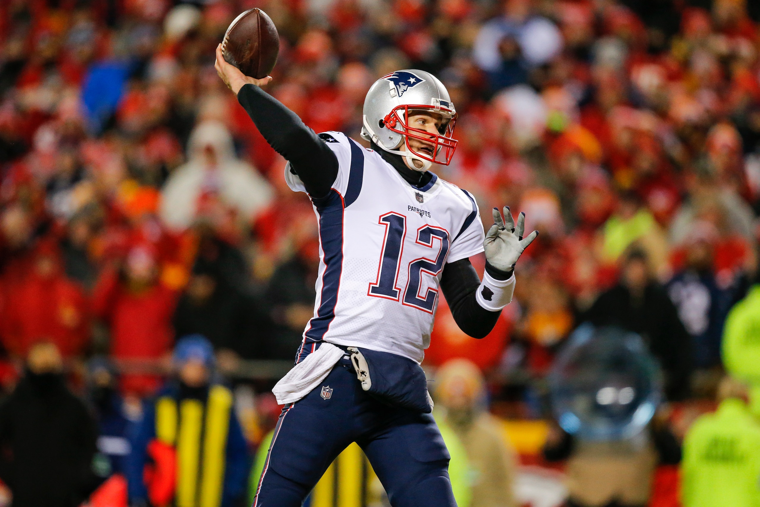 KANSAS CITY, MO - JANUARY 20: Quarterback Tom Brady #12 of the New England Patriots throws an interception in the Patriots' end zone in the first quarter during the AFC Championship Game against the Kansas City Chiefs at Arrowhead Stadium on January 20, 2