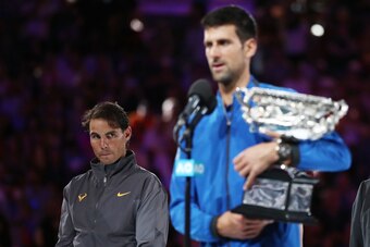 MELBOURNE, AUSTRALIA - JANUARY 27:  Rafael Nadal of Spain looks on with the runners-up trophy following defeat in his Men's Singles Final match against Novak Djokovic of Serbia during day 14 of the 2019 Australian Open at Melbourne Park on January 27, 201