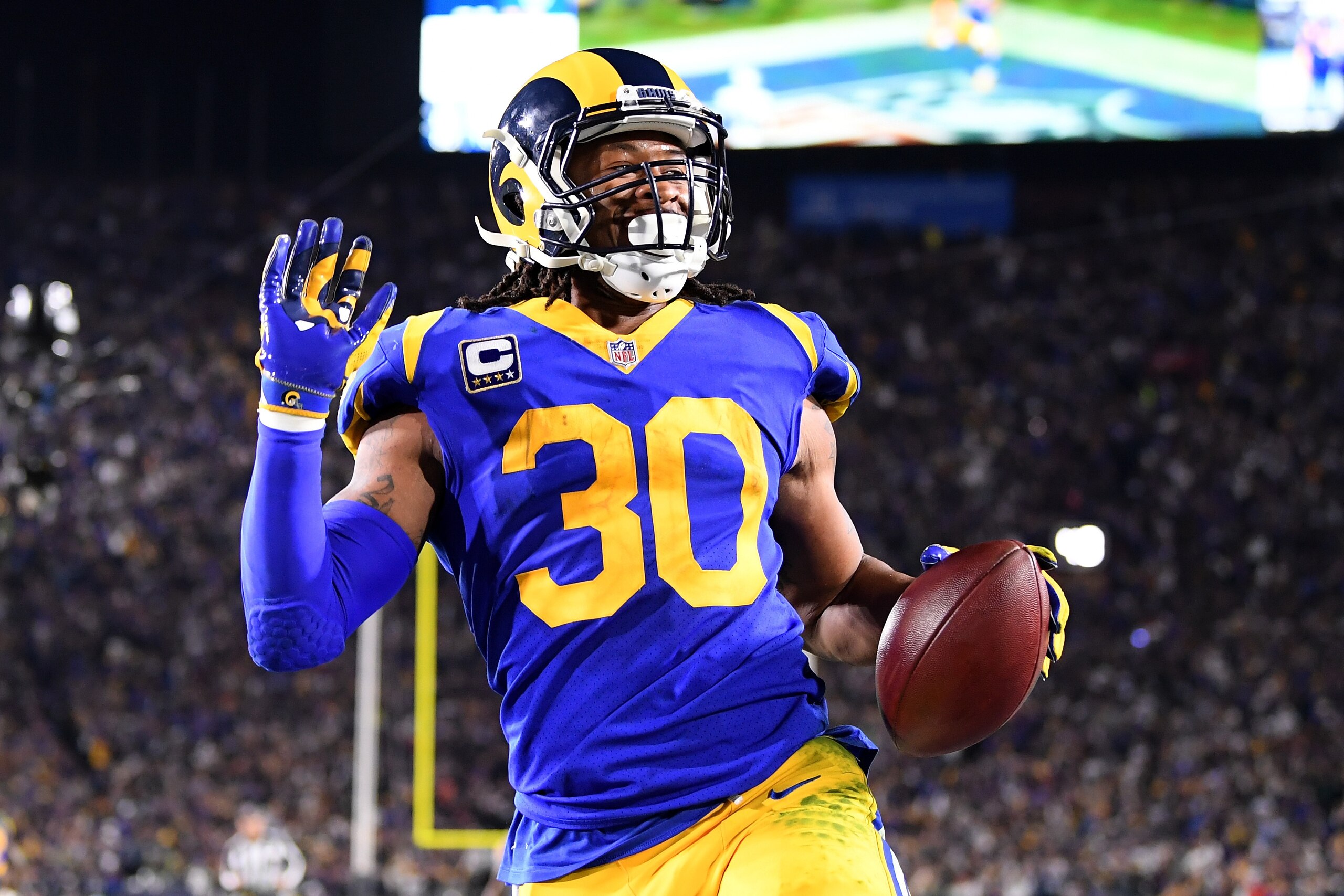 LOS ANGELES, CA - JANUARY 12:  Todd Gurley #30 of the Los Angeles Rams scores a 35 yard touchdown in the second quarter against the Dallas Cowboys in the NFC Divisional Playoff game at Los Angeles Memorial Coliseum on January 12, 2019 in Los Angeles, Cali