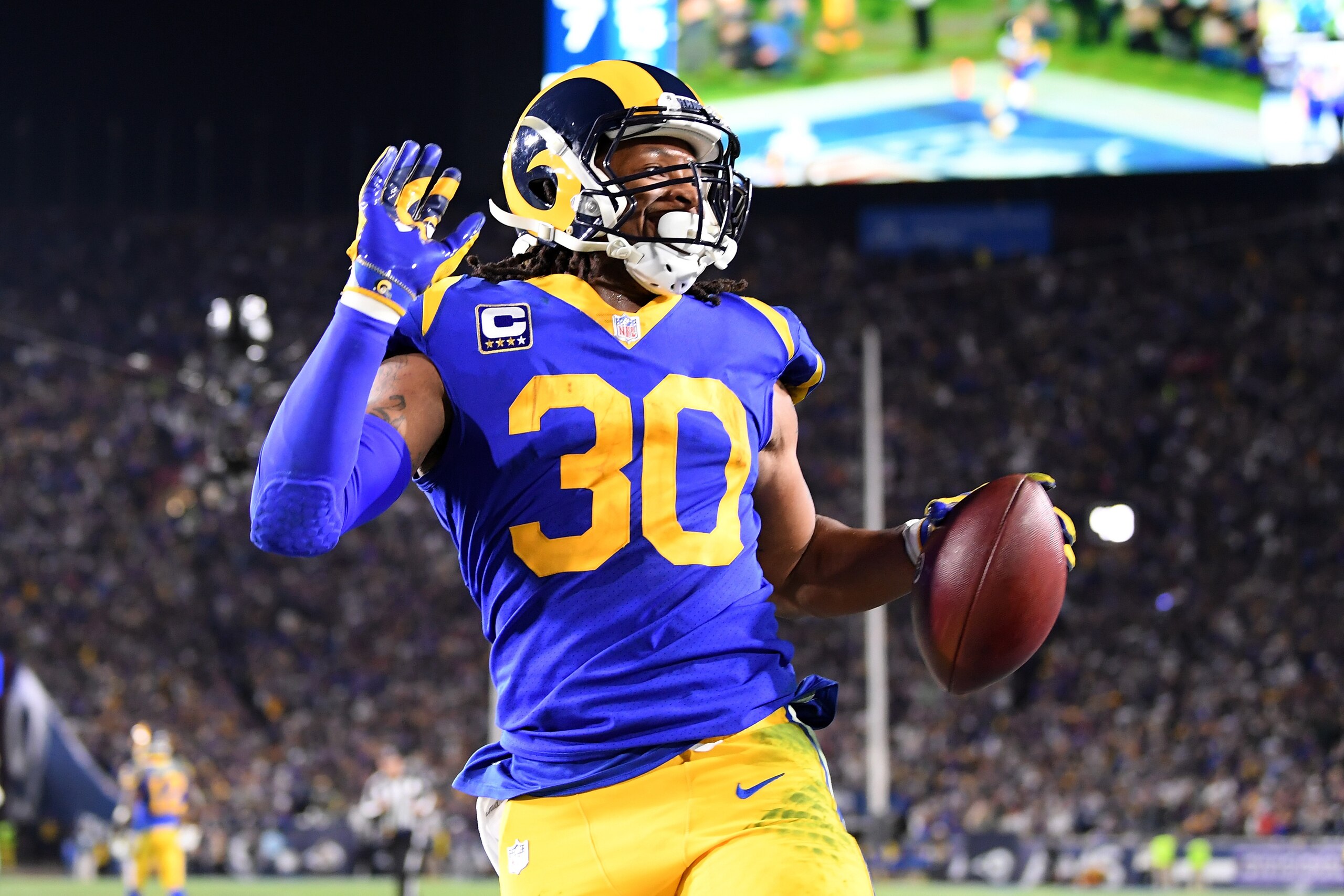LOS ANGELES, CA - JANUARY 12: Todd Gurley #30 of the Los Angeles Rams scores a 35 yard touchdown in the second quarter against the Dallas Cowboys in the NFC Divisional Playoff game at Los Angeles Memorial Coliseum on January 12, 2019 in Los Angeles, Cali LOS ANGELES, CA - JANUARY 12: Todd Gurley #30 of the Los Angeles Rams scores a 35 yard touchdown in the second quarter against the Dallas Cowboys in the NFC Divisional Playoff game at Los Angeles Memorial Coliseum on January 12, 2019 in Los Angeles, Cali
