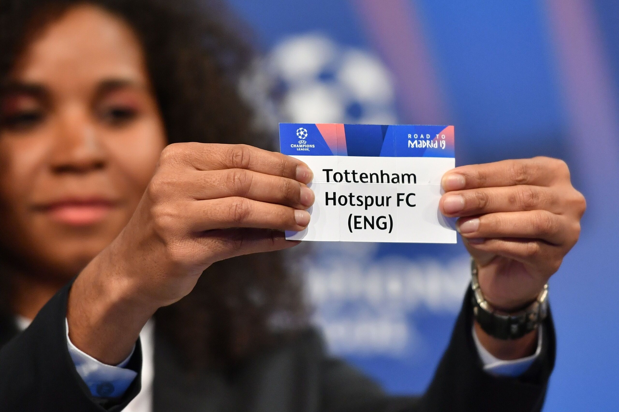 Former French football player Laura Georges shows the slip of Tottenham Hotspur during the draw for the round of 16 of the UEFA Champions League football tournament at the UEFA headquarters in Nyon on December 17, 2018. (Photo by Fabrice COFFRINI / AFP) Former French football player Laura Georges shows the slip of Tottenham Hotspur during the draw for the round of 16 of the UEFA Champions League football tournament at the UEFA headquarters in Nyon on December 17, 2018. (Photo by Fabrice COFFRINI / AFP)