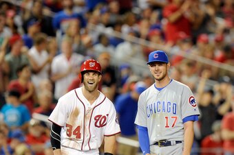 WASHINGTON, DC - JUNE 14:  Bryce Harper #34 of the Washington Nationals talks with Kris Bryant #17 of the Chicago Cubs during the eighth inning at Nationals Park on June 14, 2016 in Washington, DC. Chicago won the game 4-3.  (Photo by G Fiume/Getty Images