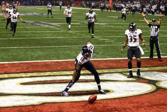 NEW ORLEANS, LA - FEBRUARY 03:  Jacoby Jones #12 of the Baltimore Ravens celebrates with teammates after he returned a kick-off 108-yards for a touchdown to open up the second half against Tramaine Brock #26 of the San Francisco 49ers during Super Bowl XL