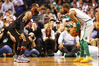 BOSTON, MA - FEBRUARY 11:  Kyrie Irving #11 of the Boston Celtics is guarded by Lebron James #23 of the Cleveland Cavaliers during the first quarter of a game at TD Garden on February 11, 2018 in Boston, Massachusetts. NOTE TO USER: User expressly acknowl