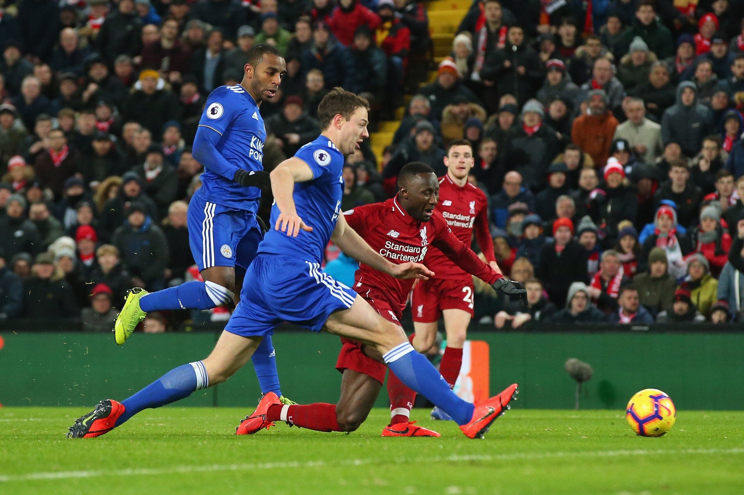 LIVERPOOL, ENGLAND - JANUARY 30: Naby Keita of Liverpool FC goes down in the penalty area under a challenge from Ricardo Pereira and Jonny Evans of Leicester City but a penalty appeal is turned down during the Premier League match between Liverpool FC an LIVERPOOL, ENGLAND - JANUARY 30: Naby Keita of Liverpool FC goes down in the penalty area under a challenge from Ricardo Pereira and Jonny Evans of Leicester City but a penalty appeal is turned down during the Premier League match between Liverpool FC an