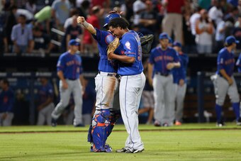 ATLANTA, GA - SEPTEMBER 20:  Jenrry Mejia #58 of the New York Mets celebrates with Travis d'Arnaud #15 (left) after defeating the Atlanta Braves 4-2 at Turner Field on September 20, 2014 in Atlanta, Georgia. (Photo by Kevin Liles/Getty Images)