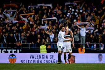 VALENCIA, SPAIN - JANUARY 29:  Santi Mina (R) of Valencia CF celebrates the victory with his teammate Dani Parejo during the Copa del Rey Quarter Final match between Valencia CF and Getafe CF at Estadio Mestalla on January 29, 2019 in Valencia, Spain. (Ph