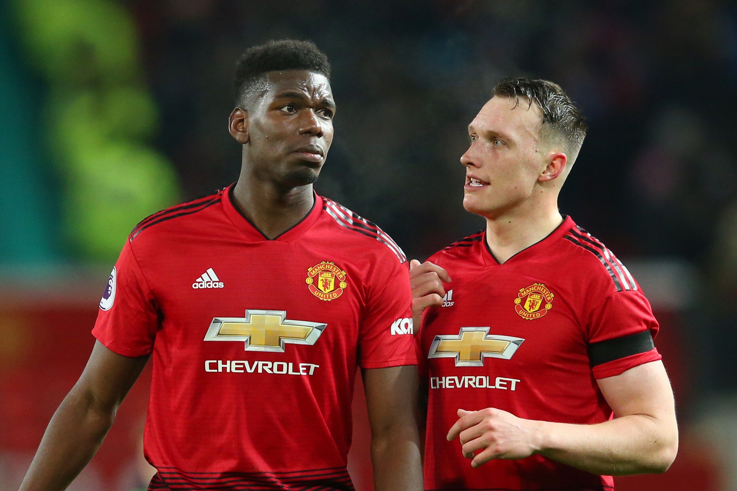 MANCHESTER, ENGLAND - JANUARY 29: Paul Pogba of Manchester United speaks to Phil Jones of Manchester United after the Premier League match between Manchester United and Burnley at Old Trafford on January 29, 2019 in Manchester, United Kingdom.  (Photo by 