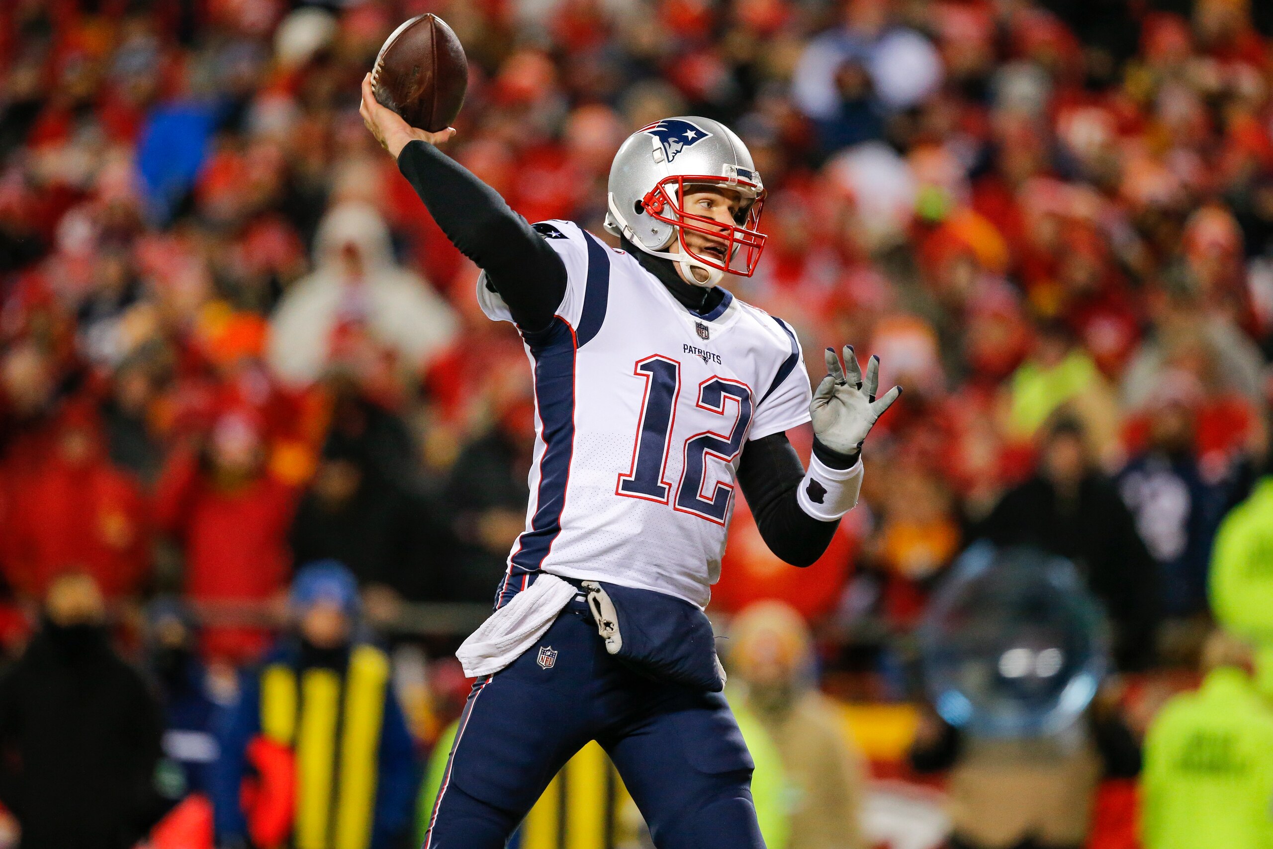 KANSAS CITY, MO - JANUARY 20: Quarterback Tom Brady #12 of the New England Patriots throws an interception in the Patriots' end zone in the first quarter during the AFC Championship Game against the Kansas City Chiefs at Arrowhead Stadium on January 20, 2