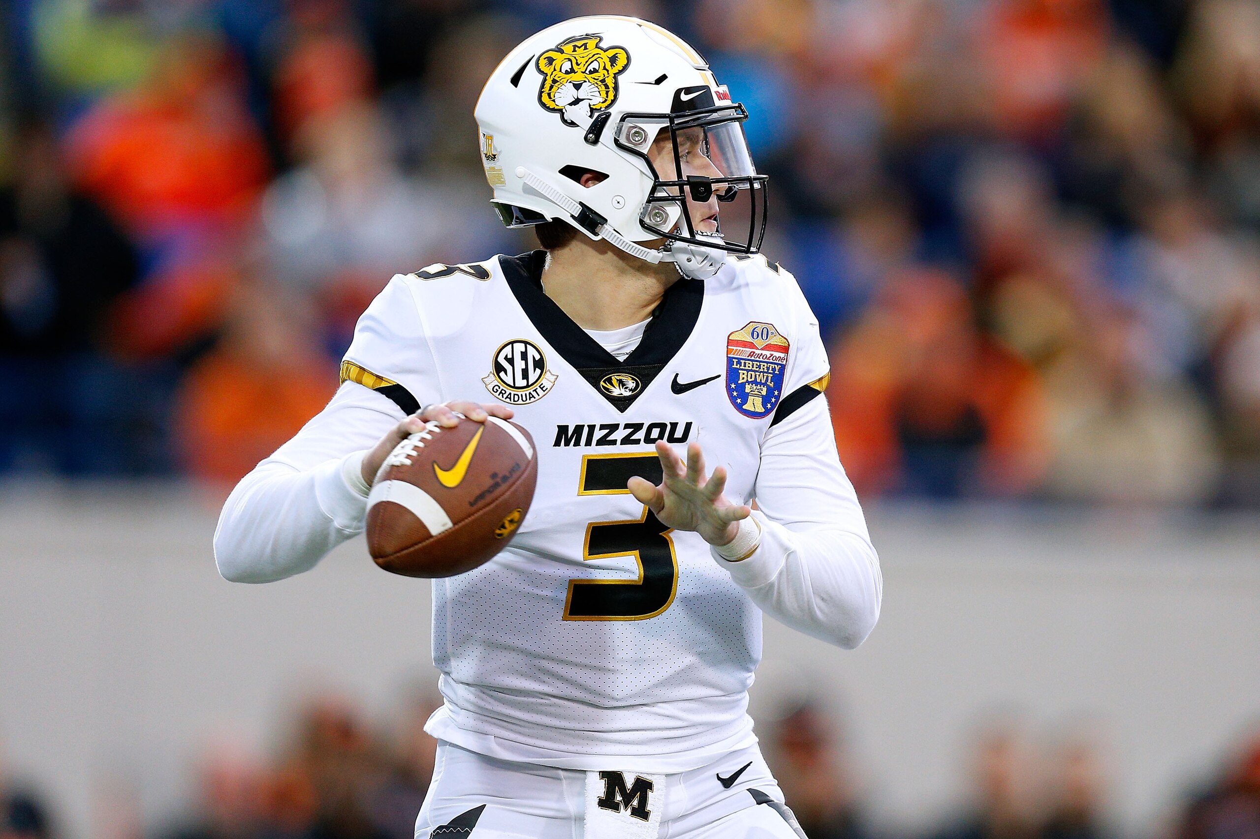 MEMPHIS, TENNESSEE - DECEMBER 31: Drew Lock #3 of the Missouri Tigers throws the ball during the AutoZone Liberty Bowl  against the Oklahoma State Cowboys at the Liberty Bowl Memorial Stadium on December 31, 2018 in Memphis, Tennessee. (Photo by Jonathan 