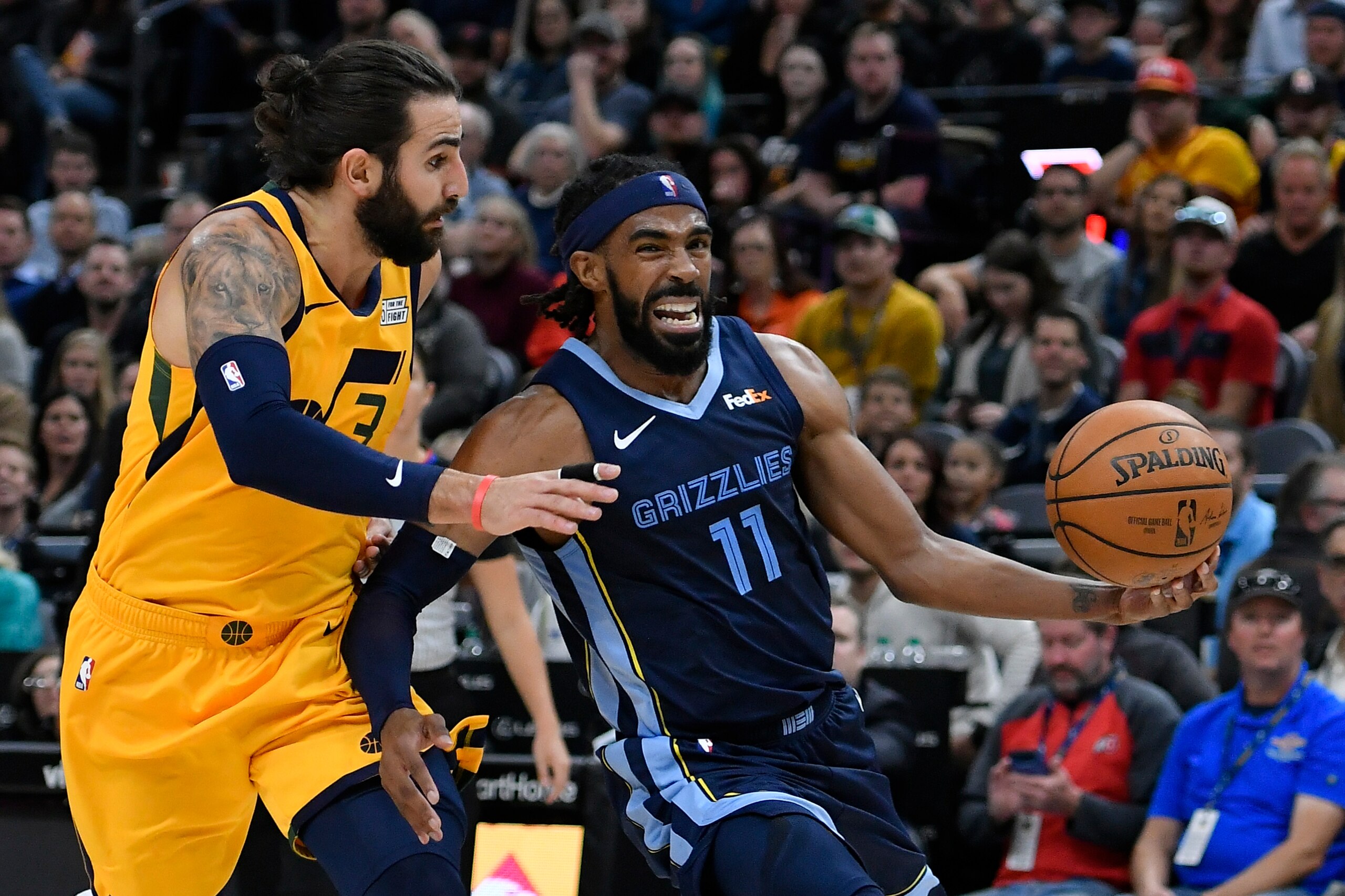 SALT LAKE CITY, UT - OCTOBER 22: Mike Conley #11 of the Memphis Grizzlies drives to the basket around Ricky Rubio #3 of the Utah Jazz in the first half of a NBA game at Vivint Smart Home Arena on October 22, 2018 in Salt Lake City, Utah. NOTE TO USER: Use