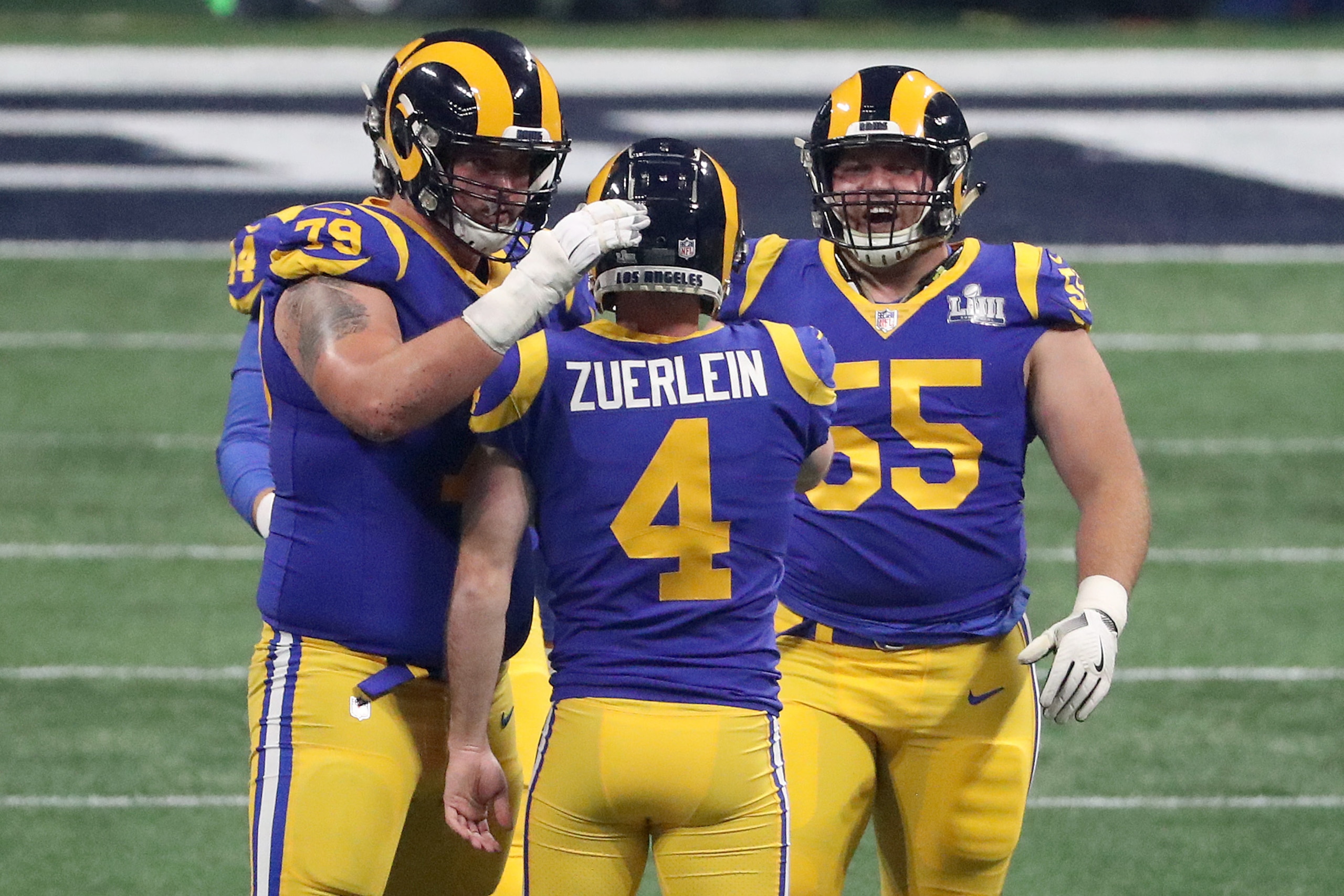ATLANTA, GEORGIA - FEBRUARY 03: Rob Havenstein #79  and Brian Allen #55 congratulate Greg Zuerlein #4 of the Los Angeles Rams for a 53-yard field goal in the third quarter during Super Bowl LIII at Mercedes-Benz Stadium on February 03, 2019 in Atlanta, Ge