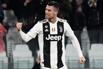 Juventus' Portuguese forward Cristiano Ronaldo celebrates after scoring his second goal during the Italian Serie A football match Juventus vs Parma on February 2, 2019 at the Juventus stadium in Turin. (Photo by Marco BERTORELLO / AFP)        (Photo credi
