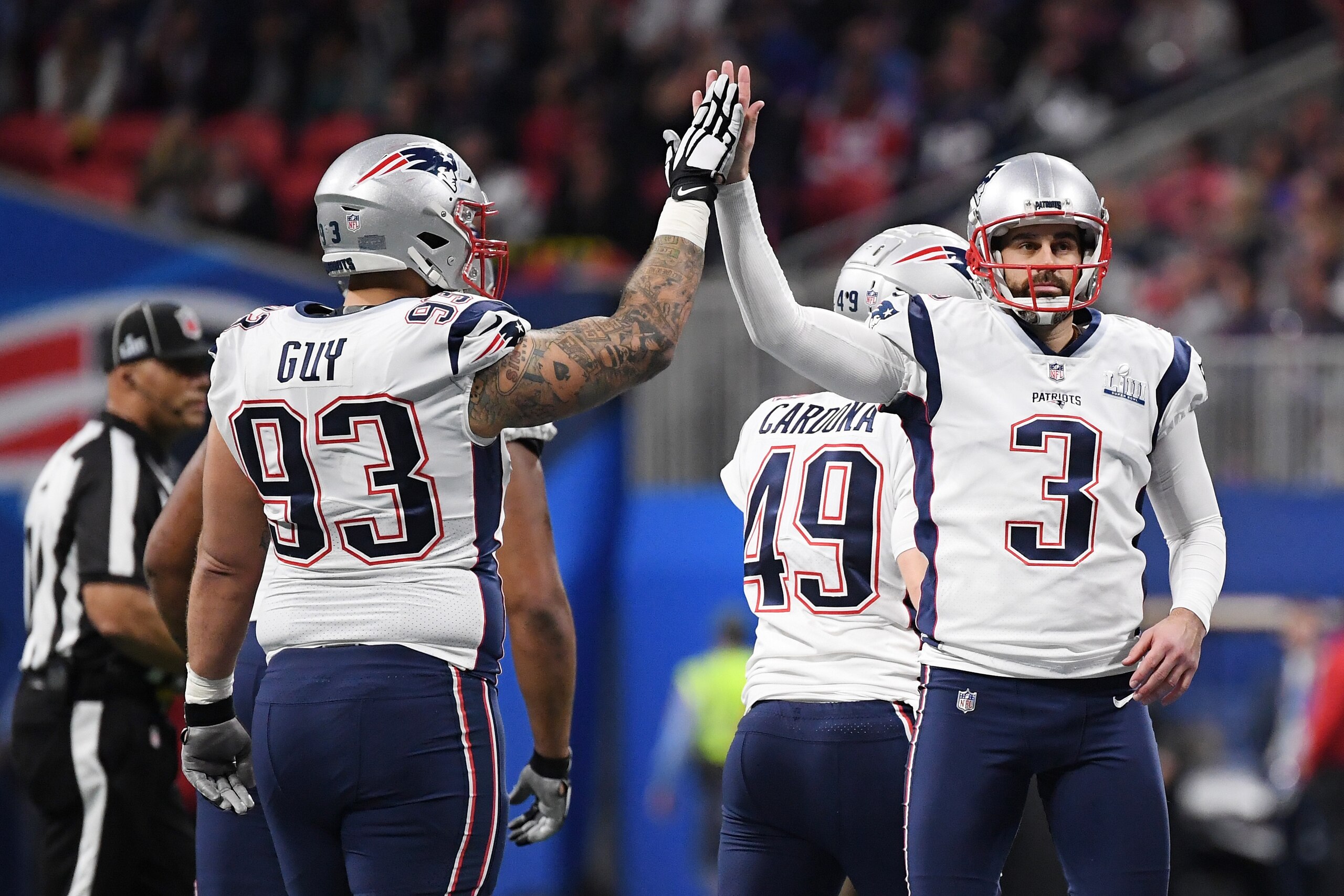 ATLANTA, GA - FEBRUARY 03: Stephen Gostkowski #3 of the New England Patriots high-fives Lawrence Guy #93 in the first half during Super Bowl LIII at Mercedes-Benz Stadium on February 3, 2019 in Atlanta, Georgia.  (Photo by Harry How/Getty Images)