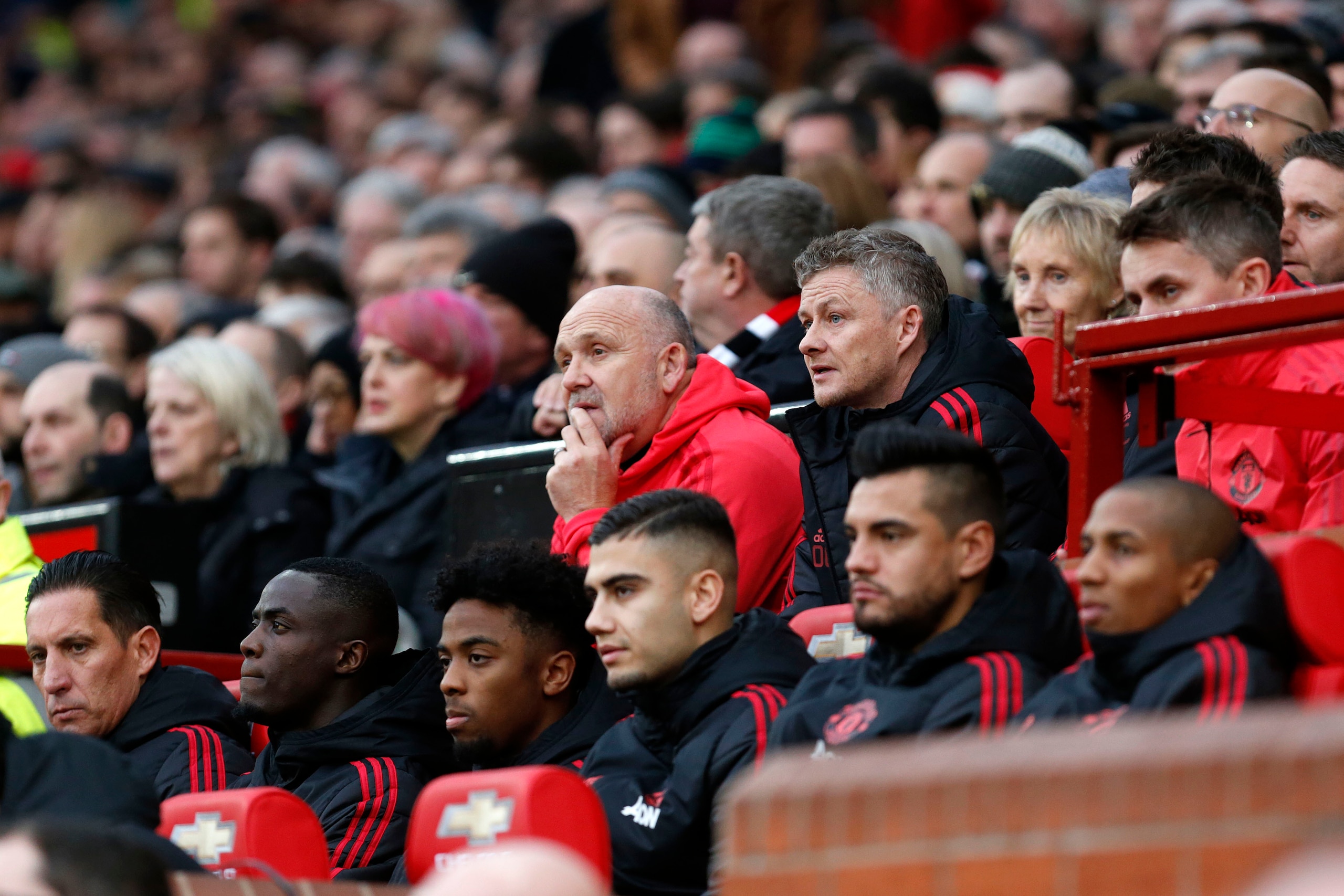 MANCHESTER, ENGLAND - DECEMBER 26: Ole Gunnar Solskjaer the Caretaker Manager of Manchester United along side Mike Phelan a first team coach of Manchester United during the Premier League match between Manchester United and Huddersfield Town at Old Traffo