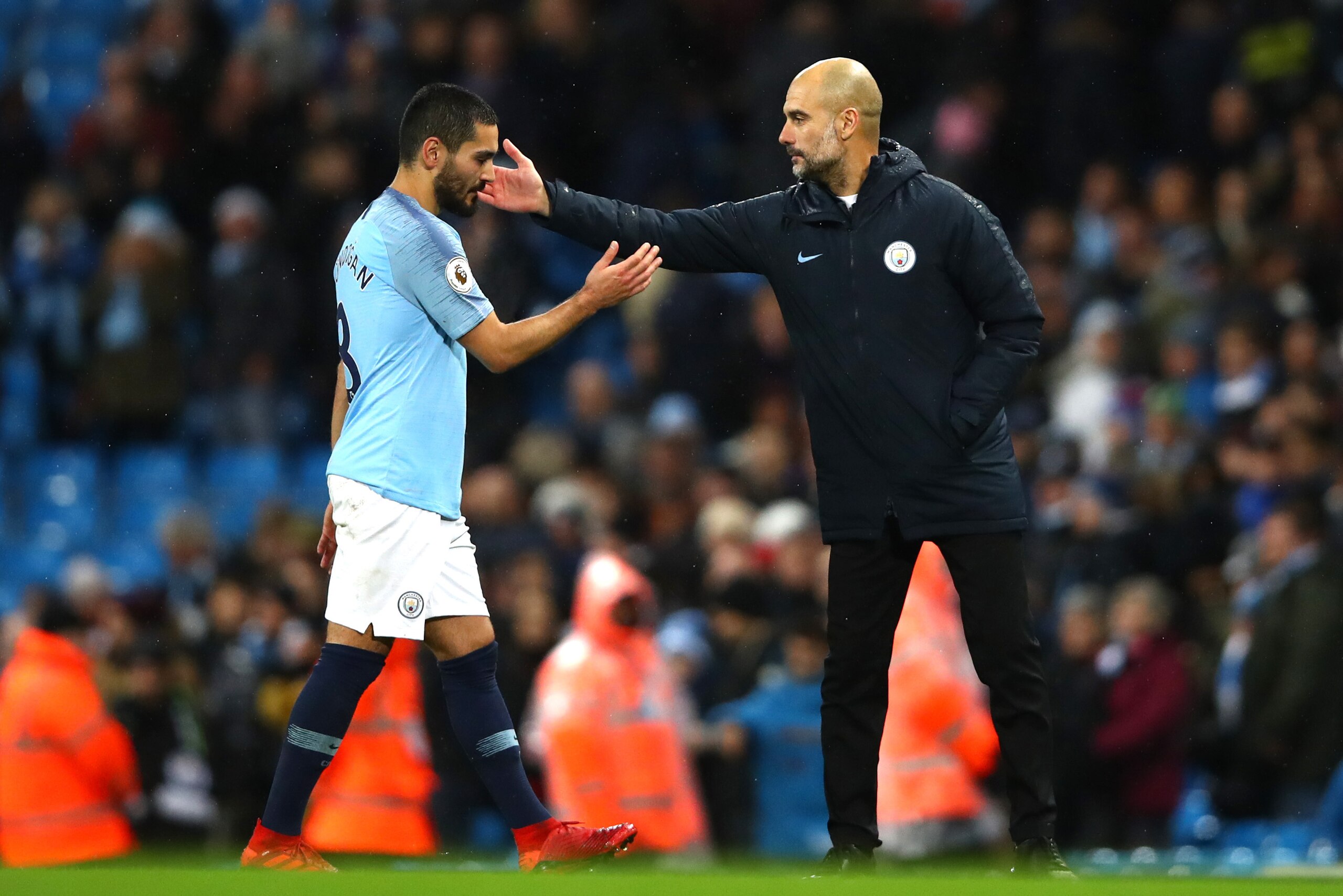MANCHESTER, ENGLAND - DECEMBER 22: Ilkay Gundogan of Manchester City shakes hands with Josep Guardiola, Manager of Manchester City after the Premier League match between Manchester City and Crystal Palace at Etihad Stadium on December 22, 2018 in Manchest