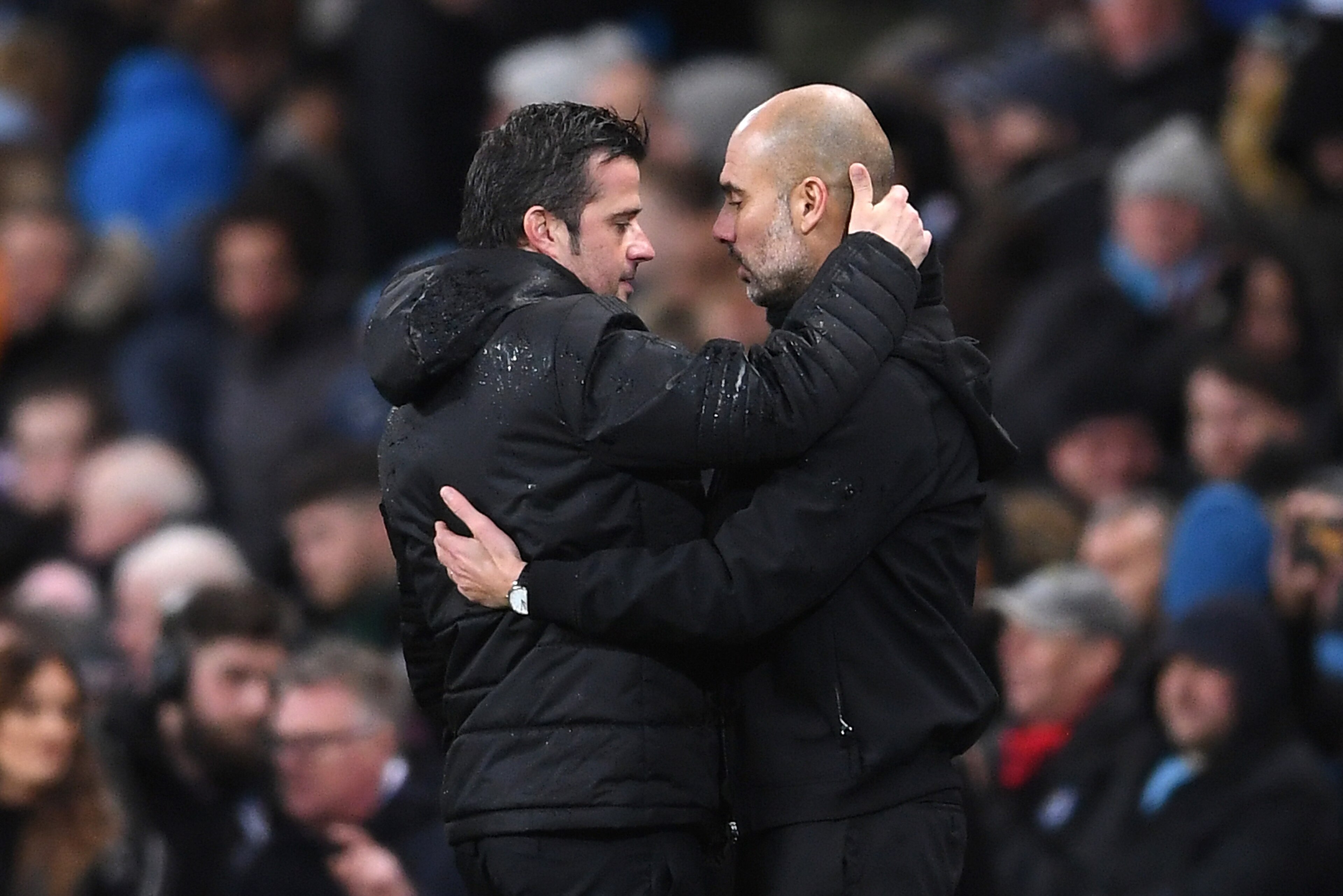 MANCHESTER, ENGLAND - JANUARY 02:  Marco Silva, Manager of Watford and Josep Guardiola, Manager of Manchester City embrace after the Premier League match between Manchester City and Watford at Etihad Stadium on January 2, 2018 in Manchester, England.  (Ph