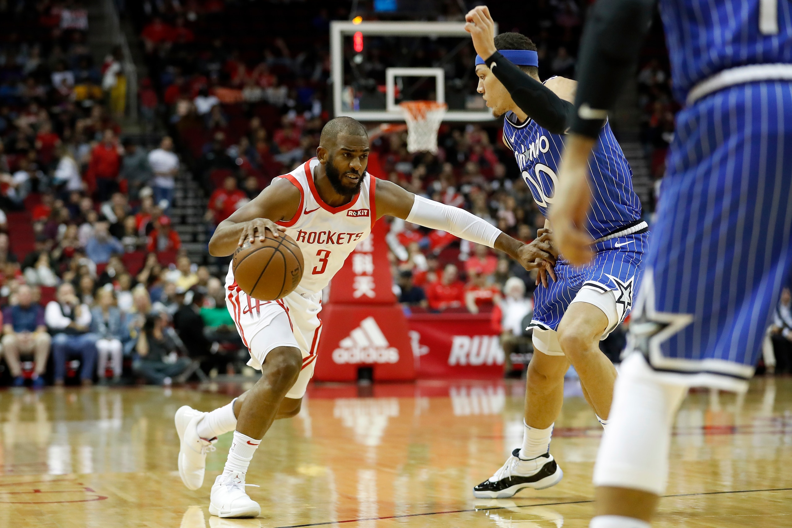 HOUSTON, TX - JANUARY 27:  Chris Paul #3 of the Houston Rockets drives to the basket defended by Aaron Gordon #00 of the Orlando Magic in the first half at Toyota Center on January 27, 2019 in Houston, Texas.  NOTE TO USER: User expressly acknowledges and