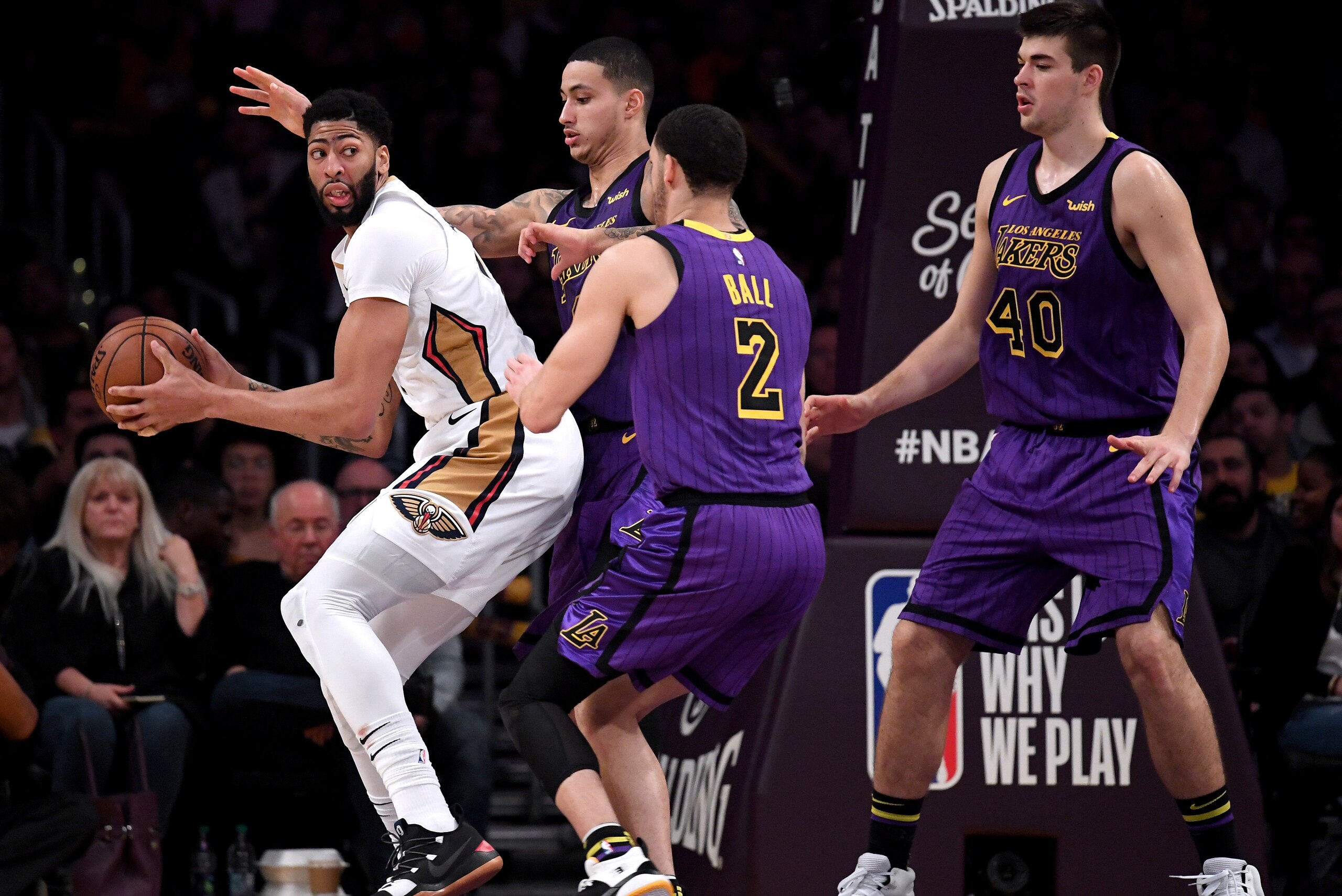 LOS ANGELES, CALIFORNIA - DECEMBER 21:  Anthony Davis #23 of the New Orleans Pelicans is defended by Kyle Kuzma #0, Lonzo Ball #2 and Ivica Zubac #40 of the Los Angeles Lakers during a 112-104 Laker win at Staples Center on December 21, 2018 in Los Angele