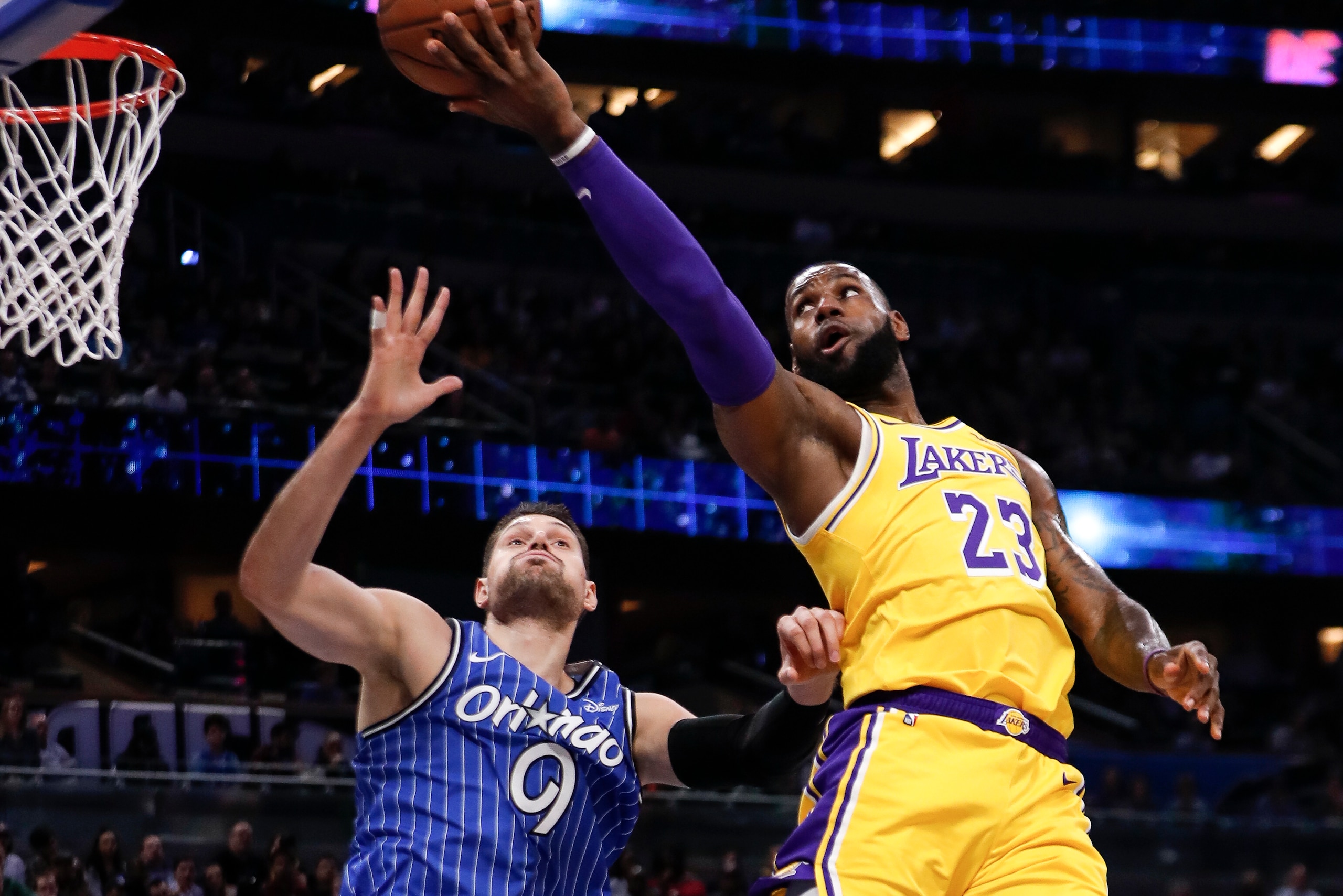 ORLANDO, FL - NOVEMBER 17: Forward LeBron James #23 of the Los Angeles Lakers shoots Center Nikola Vucevic #9 of the Orlando Magic during the game at the Amway Center on November 17, 2018 in Orlando, Florida. The Magic defeated the Lakers 130 to 117. NOTE