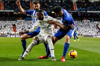 MADRID, SPAIN - FEBRUARY 3: (L-R) Ruben Duarte of Deportivo Alaves, Vinicius Junior of Real Madrid, Guillermo Maripan of Deportivo Alaves during the La Liga Santander  match between Real Madrid v Deportivo Alaves at the Santiago Bernabeu on February 3, 20