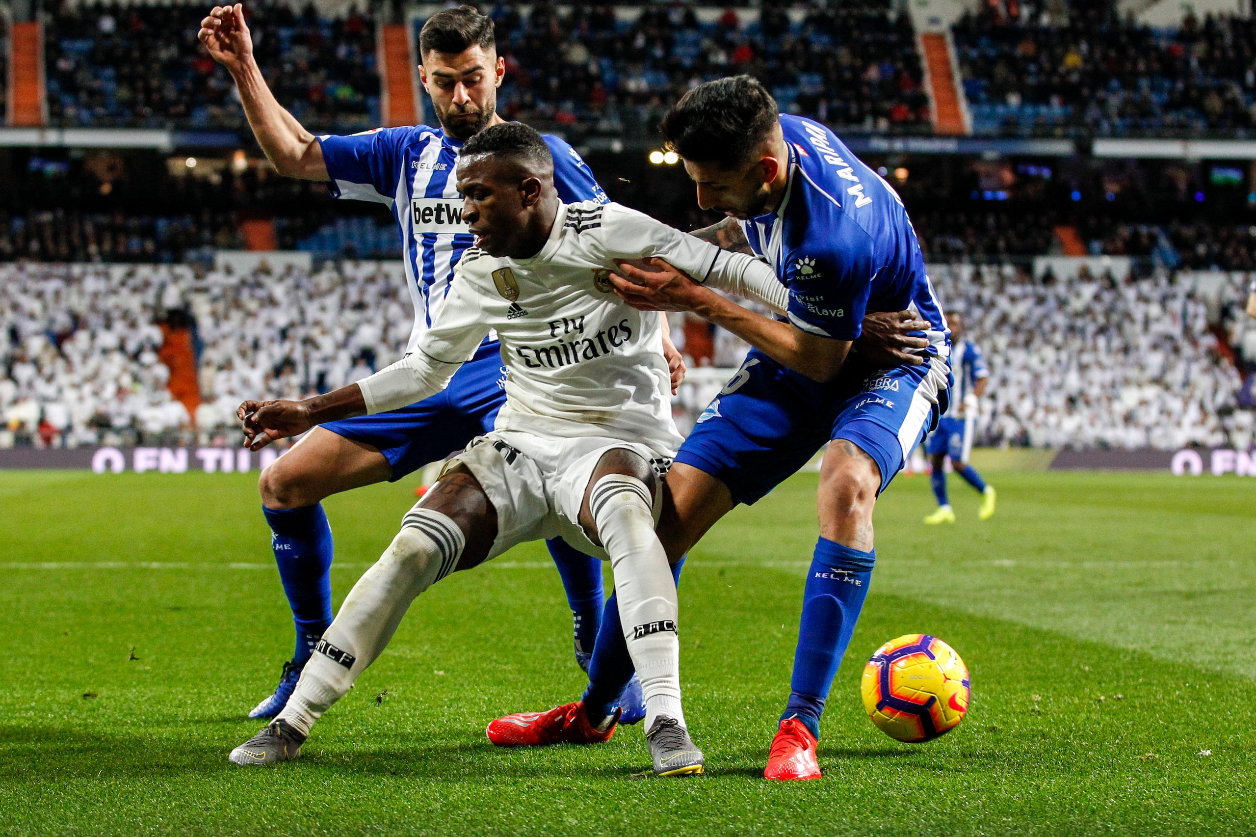MADRID, SPAIN - FEBRUARY 3: (L-R) Ruben Duarte of Deportivo Alaves, Vinicius Junior of Real Madrid, Guillermo Maripan of Deportivo Alaves during the La Liga Santander  match between Real Madrid v Deportivo Alaves at the Santiago Bernabeu on February 3, 20