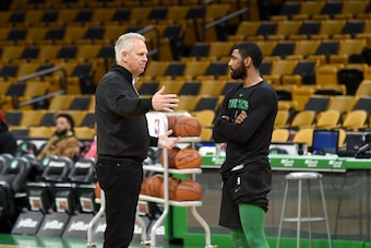 BOSTON, MA - NOVEMBER 17: General Manager Danny Ainge and Kyrie Irving #11 of the Boston Celtics talk before the game against the Utah Jazz on November 17, 2018 at the TD Garden in Boston, Massachusetts. NOTE TO USER: User expressly acknowledges and agree