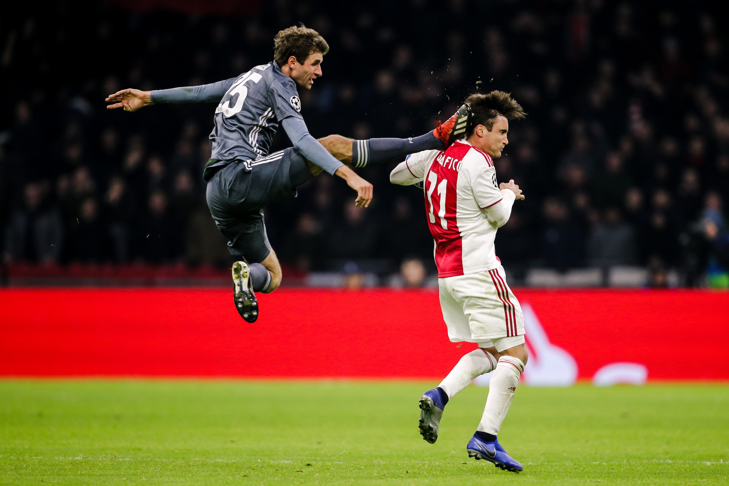 AMSTERDAM, NETHERLANDS - DECEMBER 12: (L-R) Thomas Muller of Bayern Munchen, Nicolas Tagliafico of Ajax during the UEFA Champions League  match between Ajax v Bayern Munchen at the Johan Cruijff Arena on December 12, 2018 in Amsterdam Netherlands (Photo b