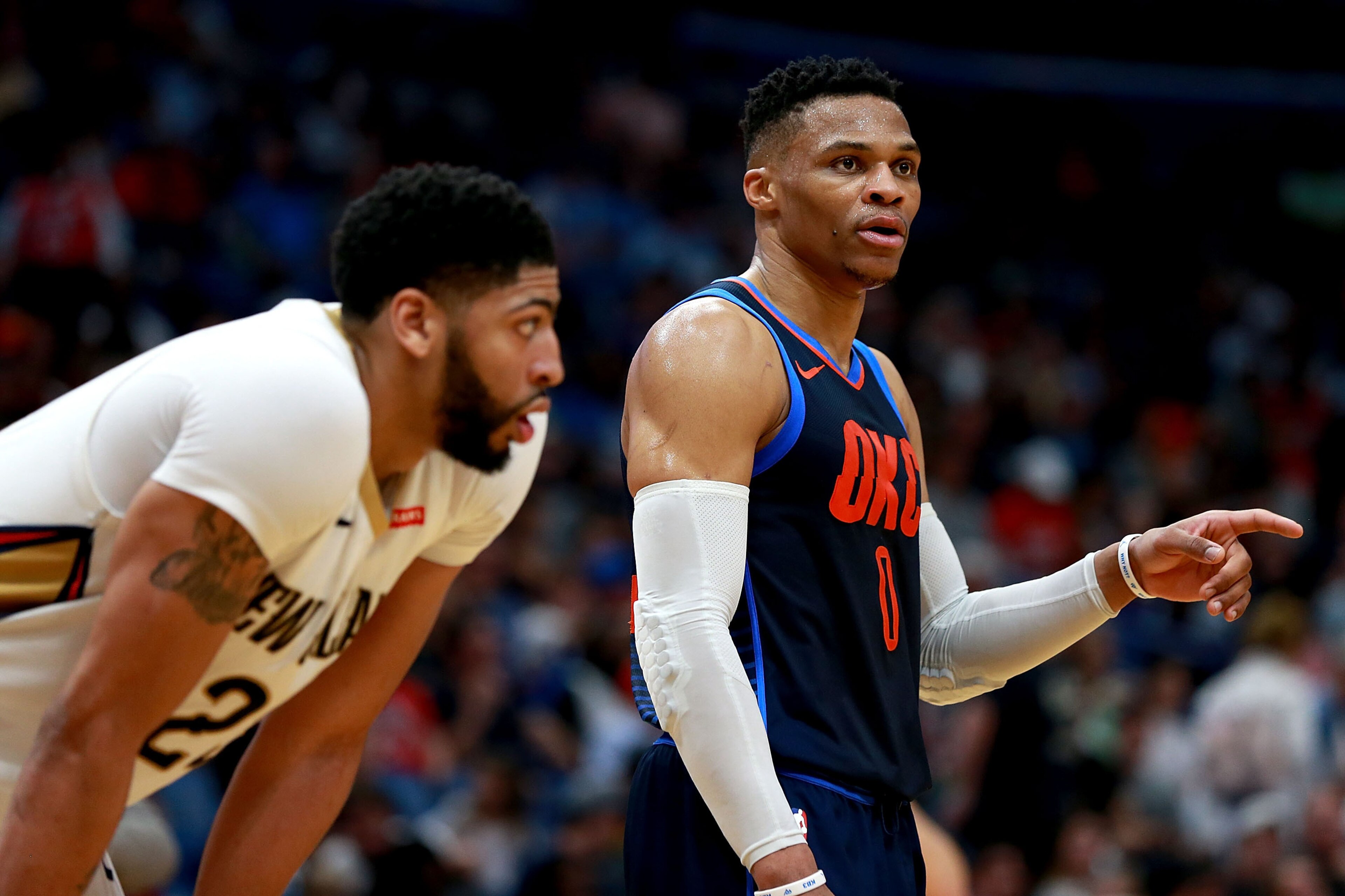 NEW ORLEANS, LA - APRIL 01:  Anthony Davis #23 of the New Orleans Pelicans and Russell Westbrook #0 of the Oklahoma City Thunder stand on the court during the first half of a NBA game at the Smoothie King Center on April 1, 2018 in New Orleans, Louisiana.