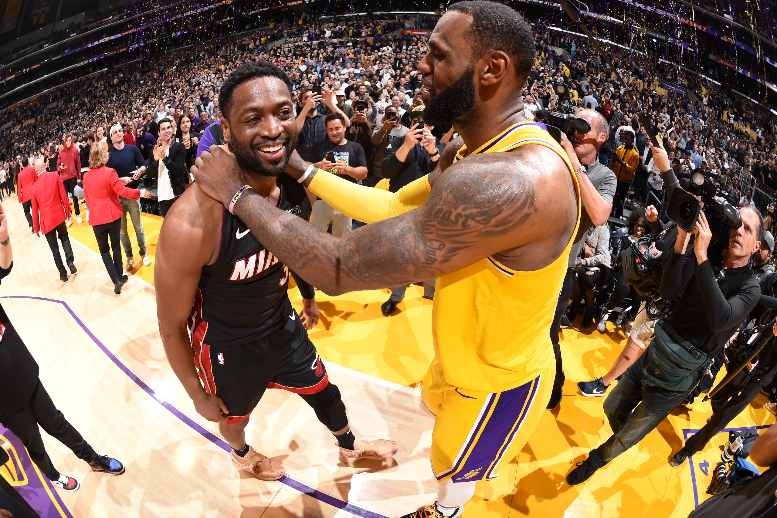 LOS ANGELES, CA - DECEMBER 10:  Dwyane Wade #3 of the Miami Heat and LeBron James #23 of the Los Angeles Lakers celebrate after the game between the two teams on December 10, 2018 at STAPLES Center in Los Angeles, California. NOTE TO USER: User expressly 