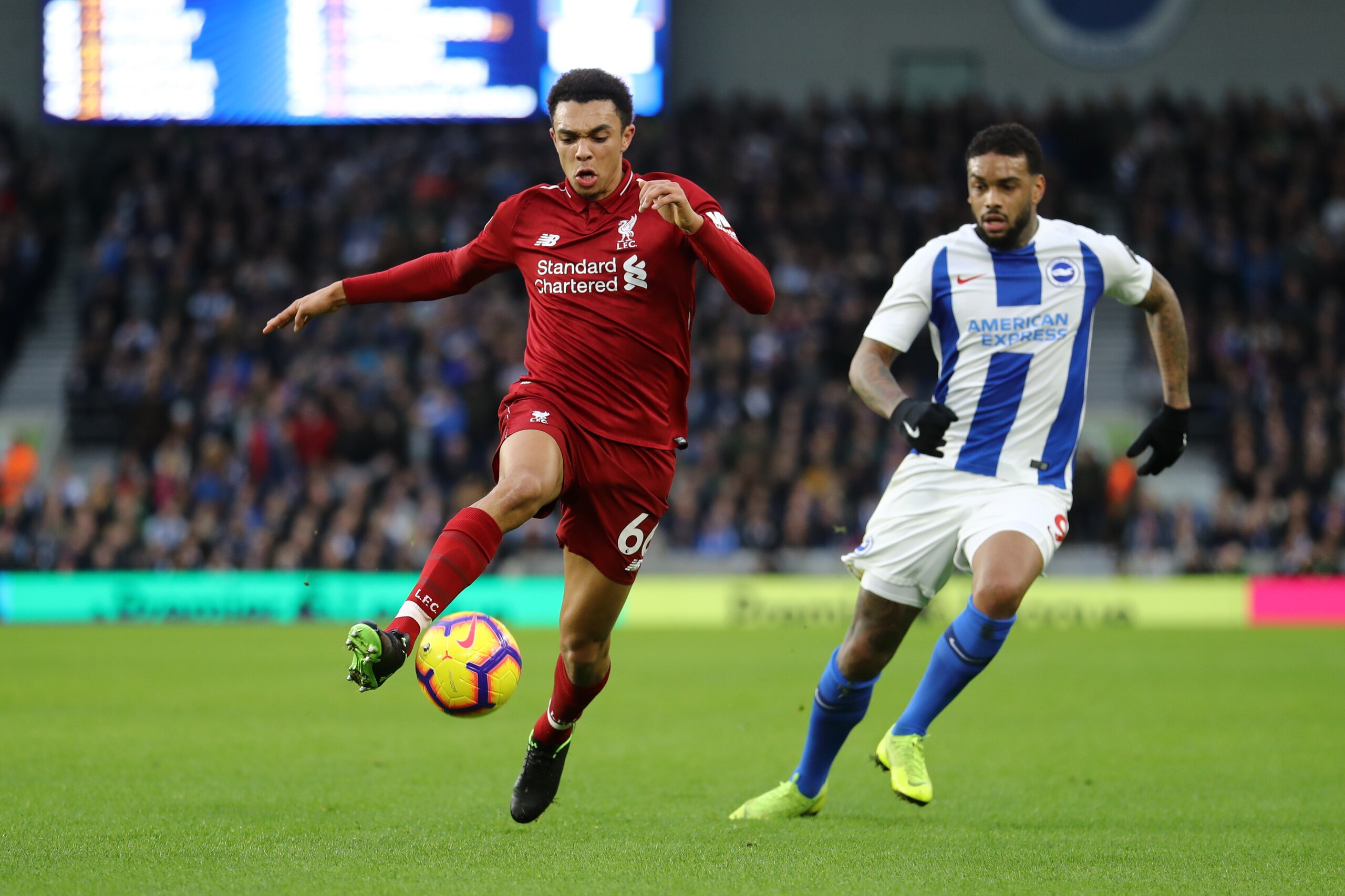 BRIGHTON, ENGLAND - JANUARY 12:  Trent Alexander-Arnold of Liverpool battles for possession with Jurgen Locadia of Brighton and Hove Albion during the Premier League match between Brighton & Hove Albion and Liverpool FC at American Express Community Stadi