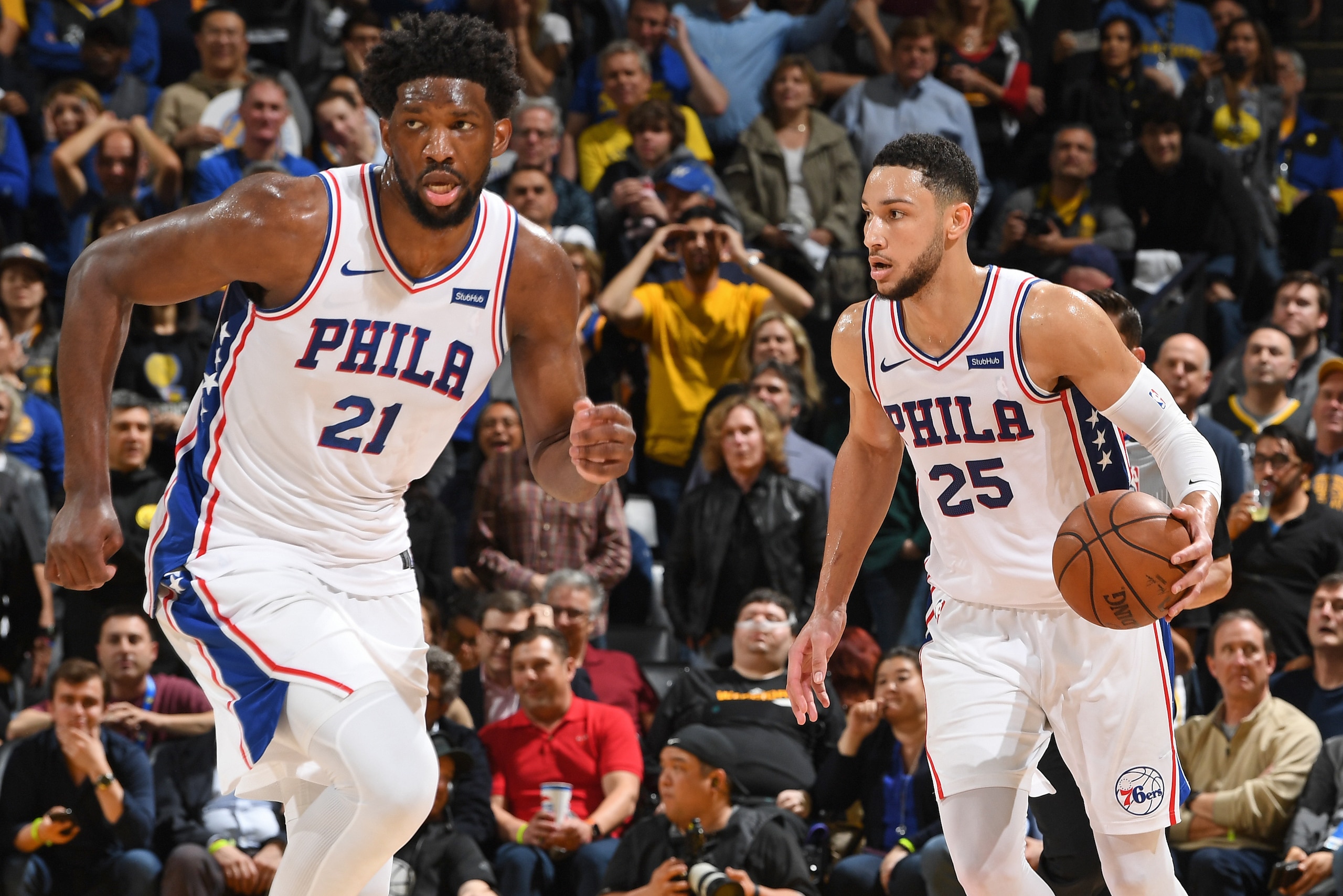 OAKLAND, CA - JANUARY 31: Ben Simmons #25 of the Philadelphia 76ers handles the ball while Joel Embiid #21 of the Philadelphia 76ers runs down the court during a game against the Golden State Warriors on January 31, 2019 at ORACLE Arena in Oakland, Califo OAKLAND, CA - JANUARY 31: Ben Simmons #25 of the Philadelphia 76ers handles the ball while Joel Embiid #21 of the Philadelphia 76ers runs down the court during a game against the Golden State Warriors on January 31, 2019 at ORACLE Arena in Oakland, Califo