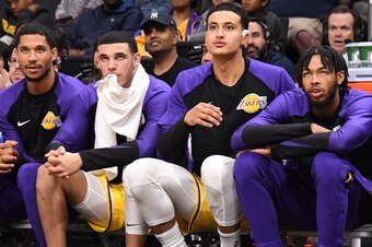 SAN JOSE, CA - OCTOBER 12: Josh Hart #3, Lonzo Ball #2, Kyle Kuzma #0 and Brandon Ingram #14 of the Los Angeles Lakers look on from the bench during a pre-season game against the Golden State Warriors on October 12, 2018 at the SAP Center in San Jose, Cal