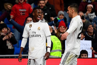 Real Madrid's Brazilian forward Vinicius Junior (L) celebrates scoring a goal during the Spanish league football match Real Madrid CF against Club Deportivo Alaves at the Santiago Bernabeu stadium in Madrid on February 3, 2019. (Photo by GABRIEL BOUYS / A