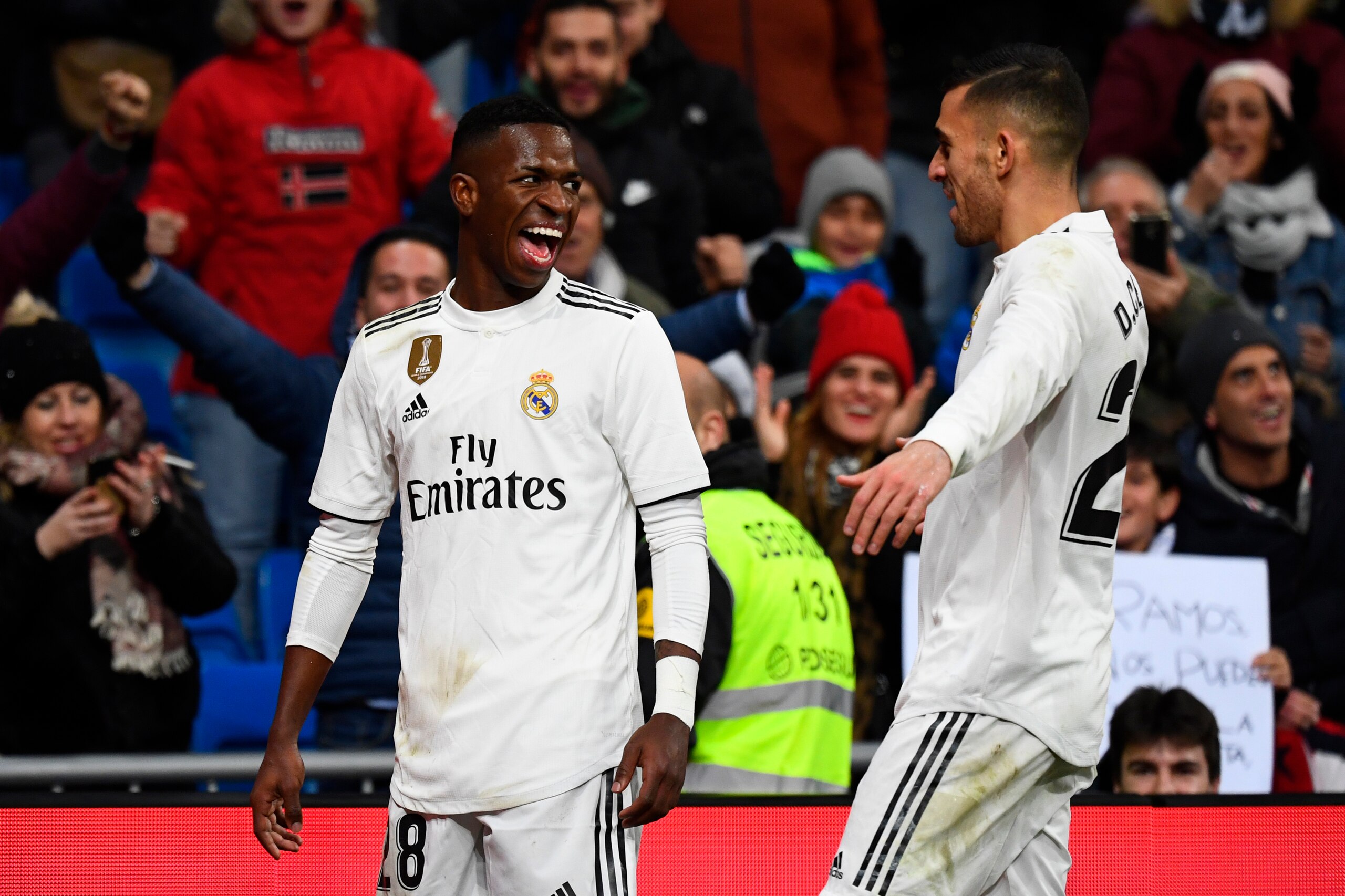 Real Madrid's Brazilian forward Vinicius Junior (L) celebrates scoring a goal during the Spanish league football match Real Madrid CF against Club Deportivo Alaves at the Santiago Bernabeu stadium in Madrid on February 3, 2019. (Photo by GABRIEL BOUYS / A