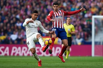 MADRID, SPAIN - FEBRUARY 09: Alvaro Morata of Atletico de Madrid competes for the ball with Casemiro of Real Madrid during the La Liga match between Club Atletico de Madrid and Real Madrid CF at Wanda Metropolitano on February 09, 2019 in Madrid, Spain. (