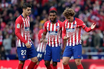 MADRID, SPAIN - FEBRUARY 9: Antoine Griezmann of Atletico Madrid celebrates 1-1 with Alvaro Morata of Atletico Madrid, Thomas Lemar of Atletico Madrid  during the La Liga Santander  match between Atletico Madrid v Real Madrid at the Estadio Wanda Metropol