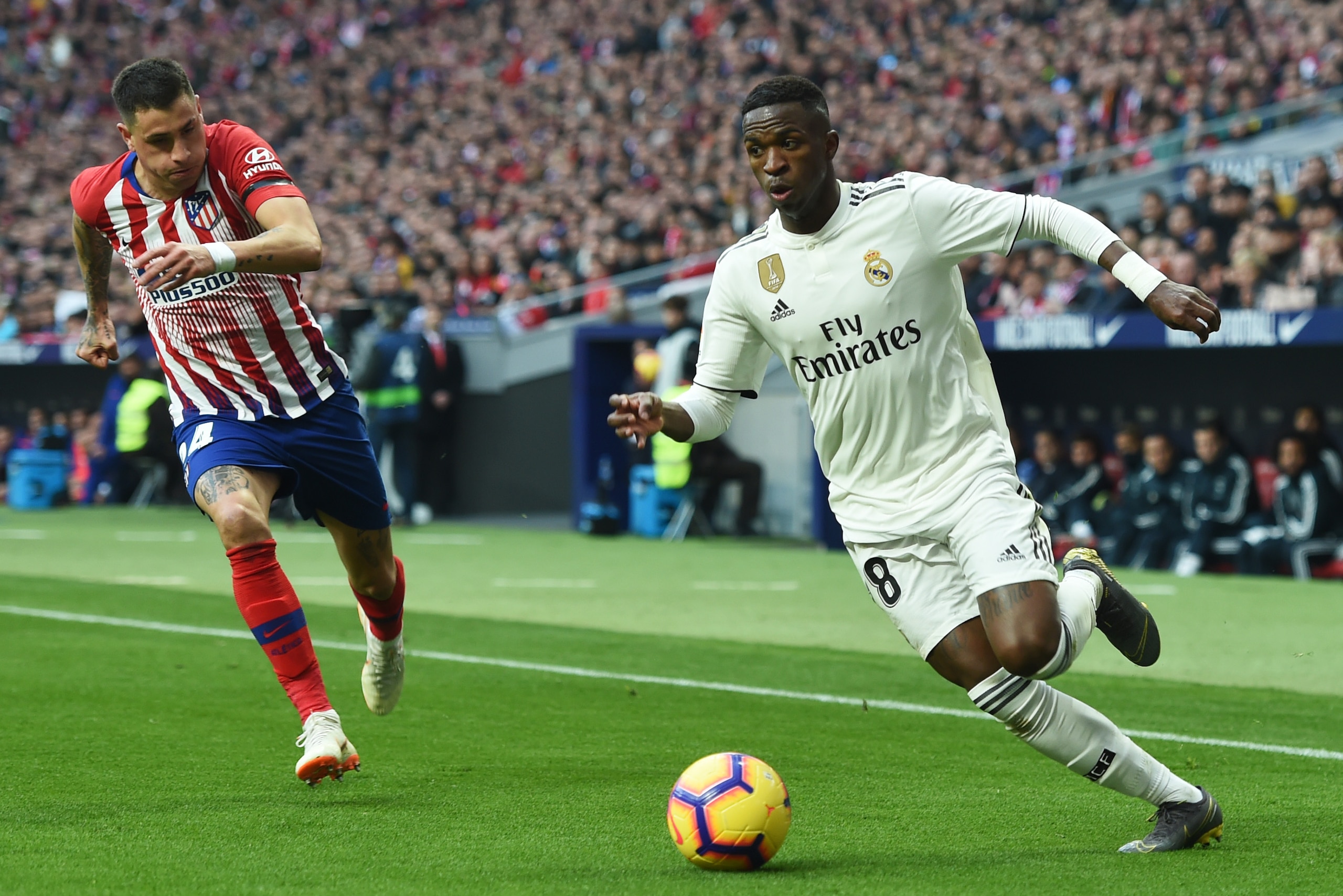 MADRID, SPAIN - FEBRUARY 09:  Vinicius Junior of Real Madrid is chased by Jose Gimenez of Atletico Madrid during the La Liga match between Club Atletico de Madrid and Real Madrid CF at Wanda Metropolitano on February 09, 2019 in Madrid, Spain. (Photo by D