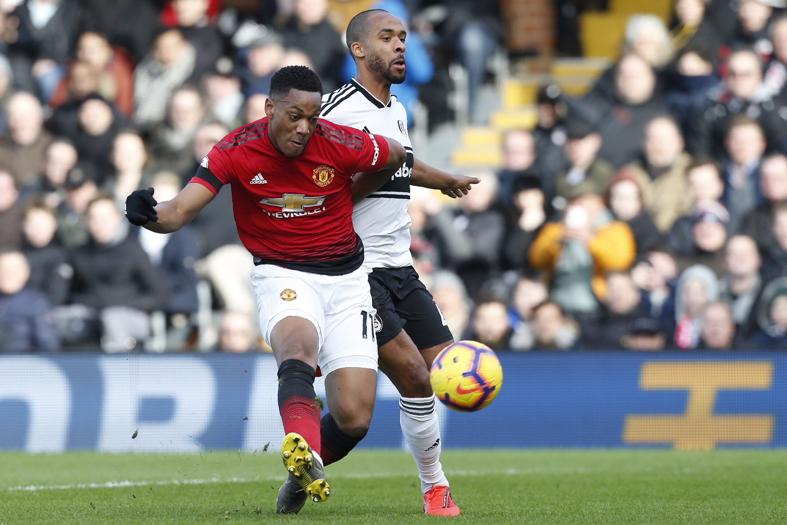 Manchester United's French striker Anthony Martial shoots to score their second goal during the English Premier League football match between Fulham and Manchester United at Craven Cottage in London on February 9, 2019. (Photo by Ian KINGTON / AFP) / REST