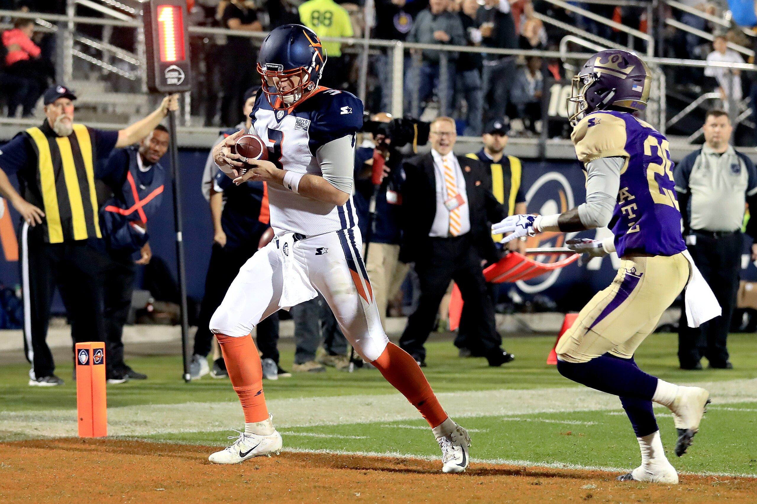 ORLANDO, FLORIDA - FEBRUARY 09:  Garrett Gilbert #3 of Orlando Apollos scores a second quarter touchdown past Damian Swann #29 of Atlanta Legends on February 09, 2019 in Orlando, Florida. (Photo by Sam Greenwood/AAF/Getty Images)