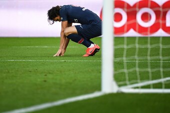 Paris Saint-Germain's Uruguayan forward Edinson Cavani reacts as he suffers an injury after scoring a goal during the French L1 football match between Paris Saint-Germain (PSG) and FC Girondins de Bordeaux at the Parc des Princes Stadium, in Paris, on Feb