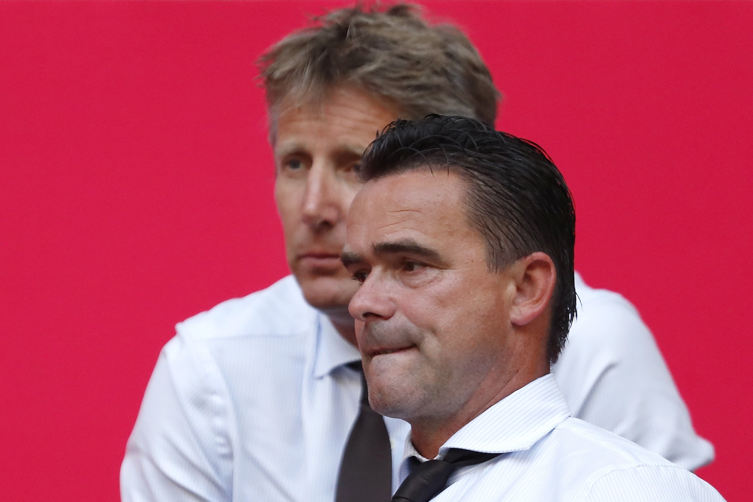 (L-R) general director Edwin van der Sar of Ajax, technical director Marc Overmars of Ajax, during the UEFA Champions League second round qualifying first leg match between Ajax Amsterdam and Sturm Graz at the Johan Cruijff Arena on July 25, 2018 in Amste