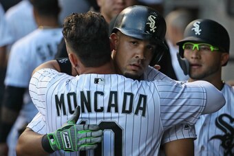 CHICAGO, IL - MAY 04:  Jose Abreu #79 of the Chicago White Sox gets a hug from Yoan Moncada #10 after hitting a two run home run in the 1st inning against the Minnesota Twins at Guaranteed Rate Field on May 4, 2018 in Chicago, Illinois.  (Photo by Jonatha